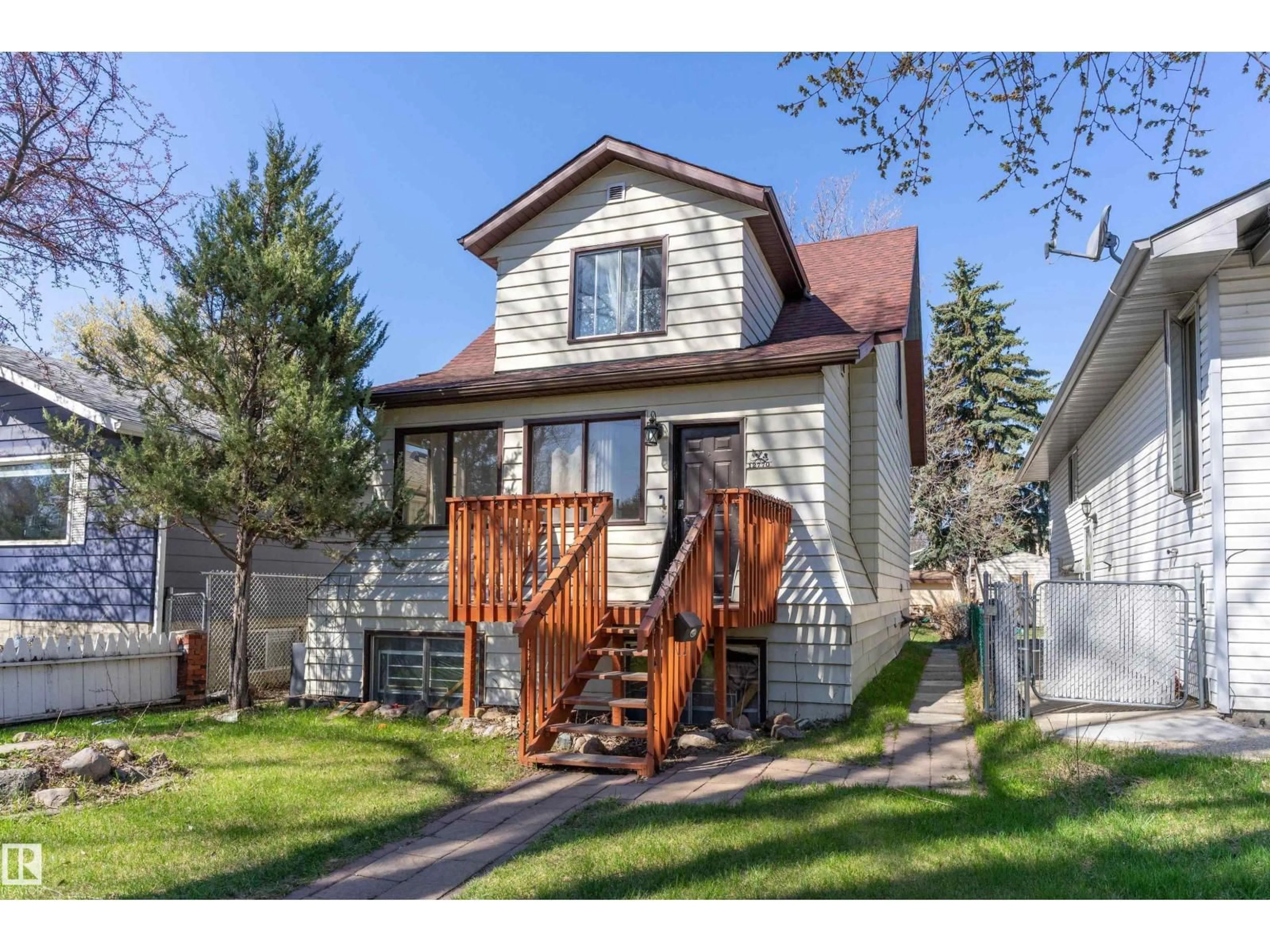 Home with vinyl exterior material, street for 12770 117 ST, Edmonton Alberta T5E5J5