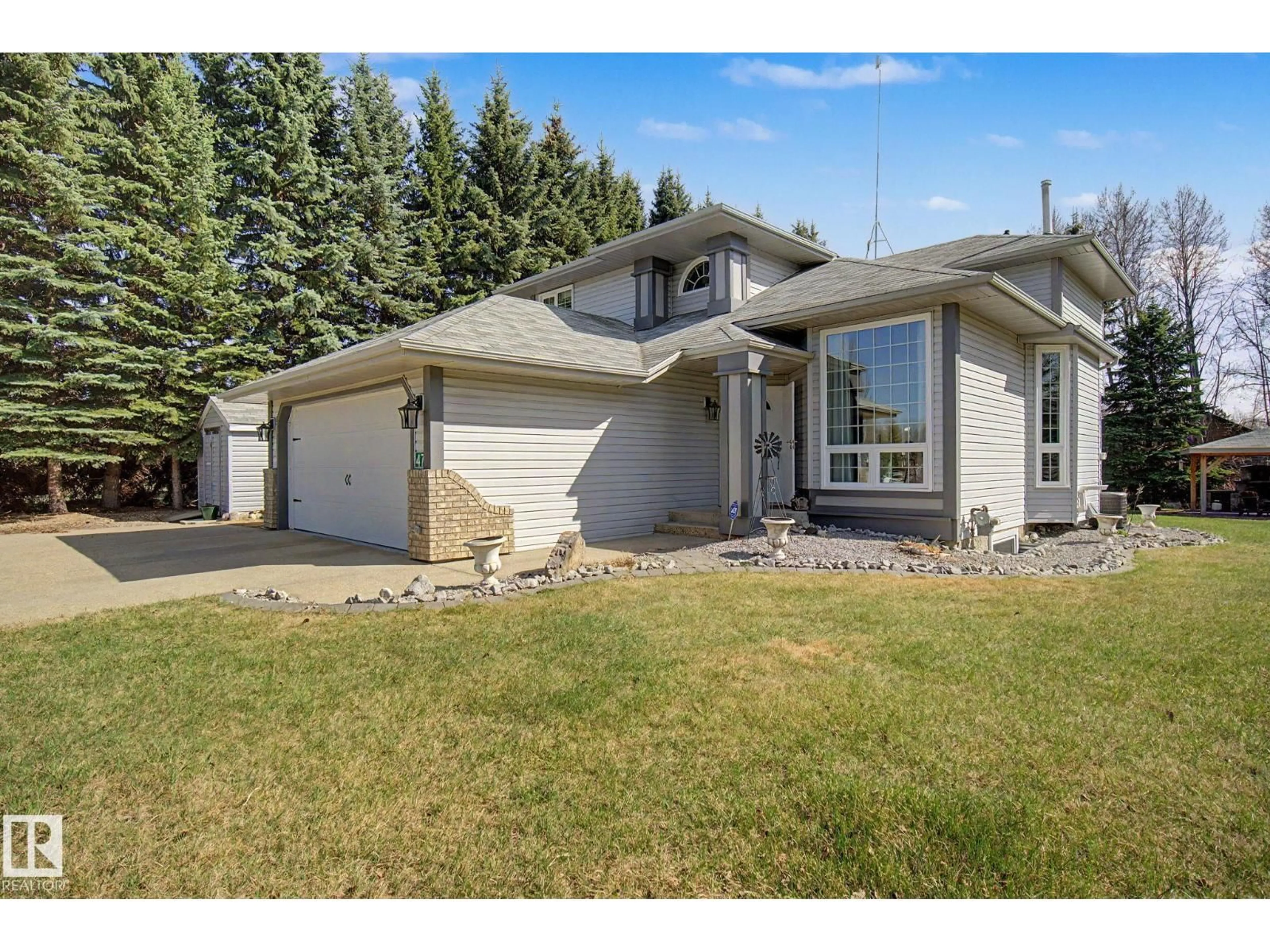 Home with vinyl exterior material, street for 47 - 26413 TWP ROAD 510, Rural Parkland County Alberta T7Y1E2
