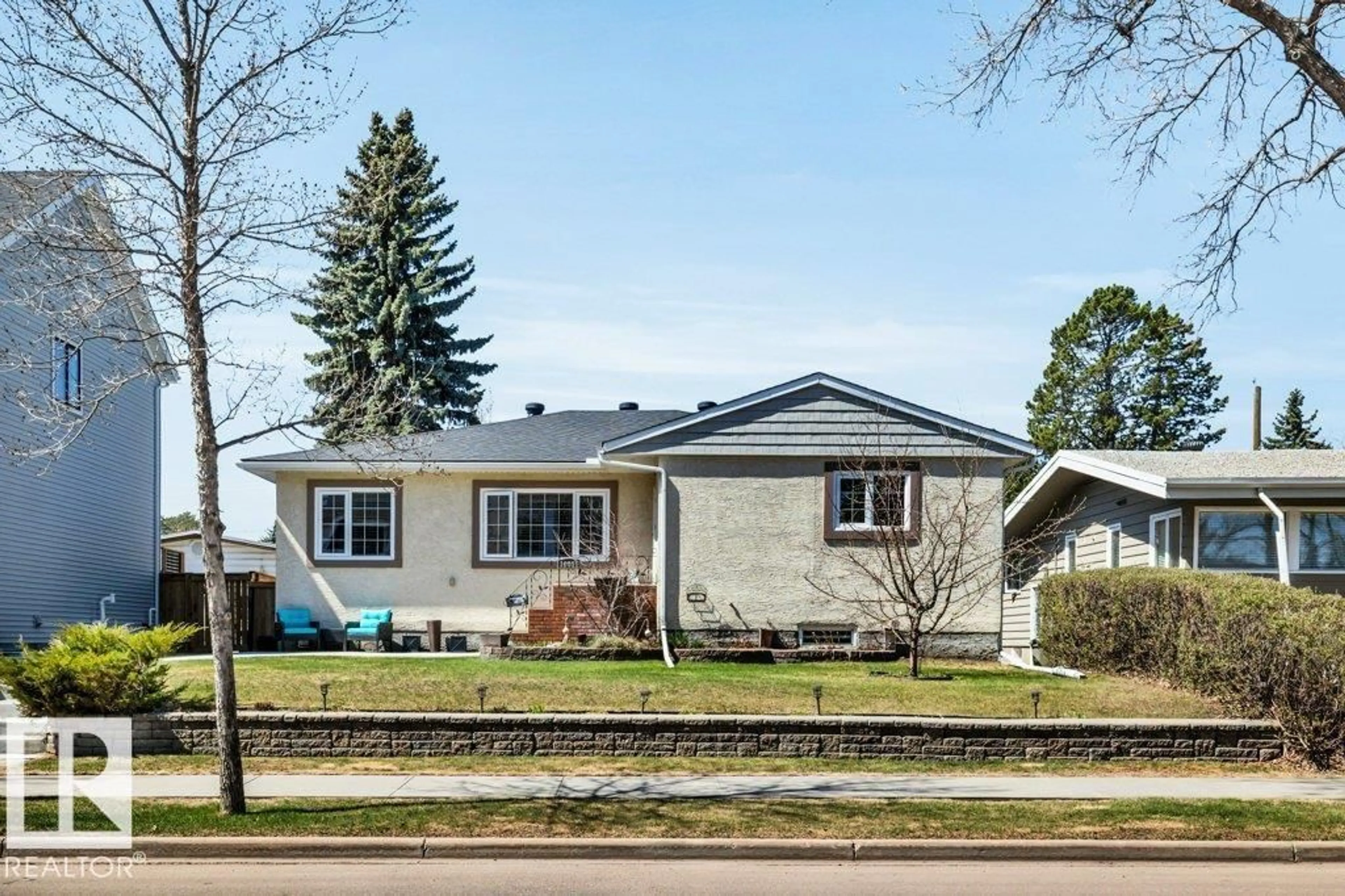 Home with vinyl exterior material, street for NW - 10616 136 ST, Edmonton Alberta T5N2G2