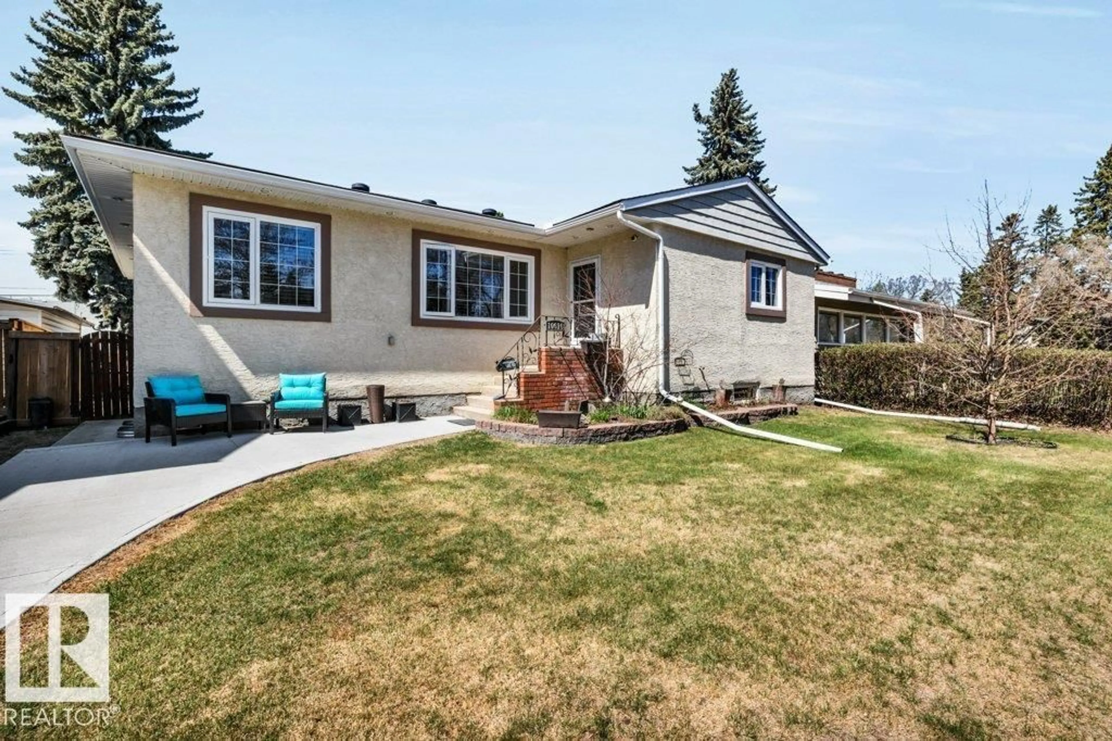 Home with vinyl exterior material, street for NW - 10616 136 ST, Edmonton Alberta T5N2G2