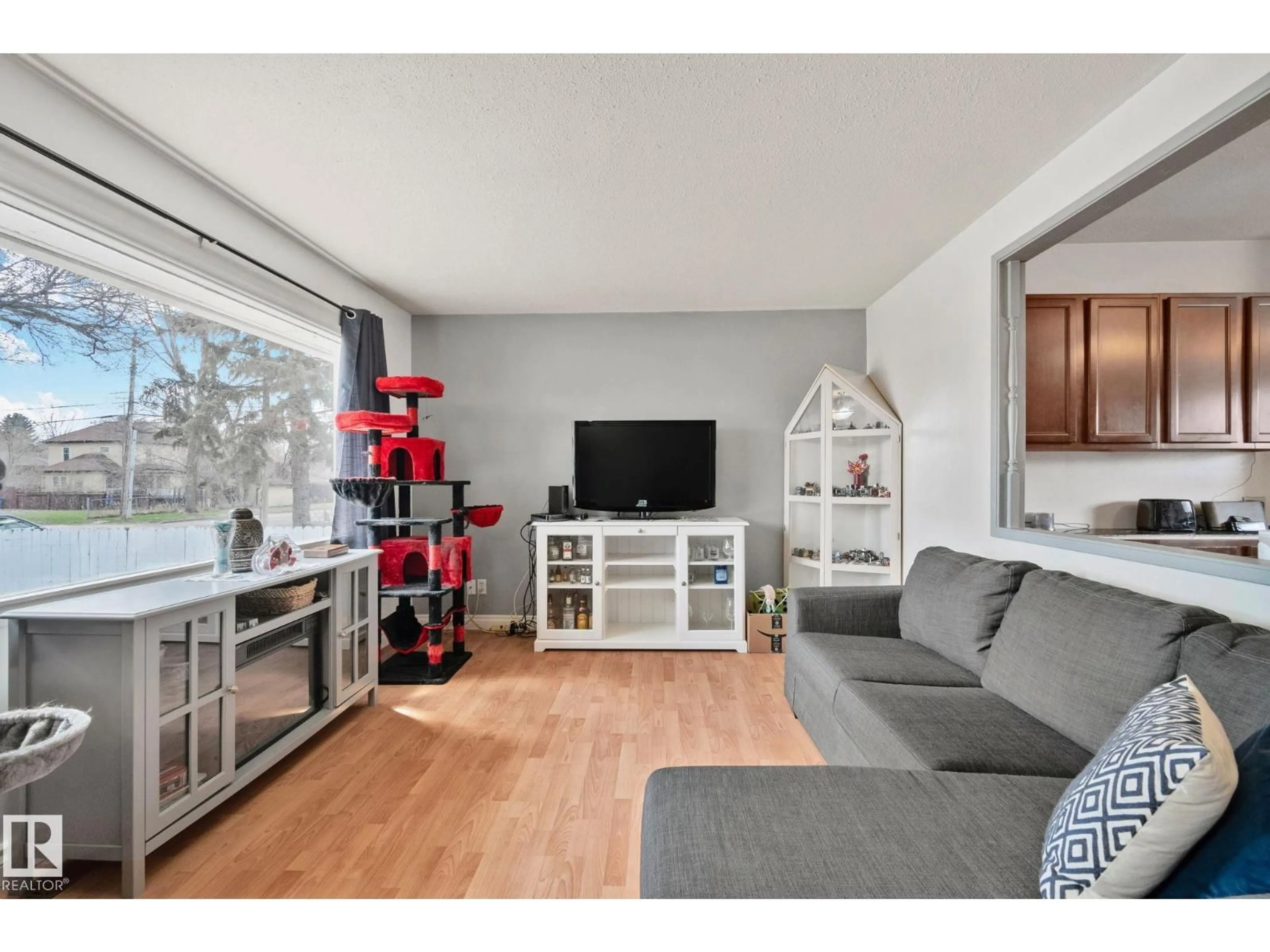Living room with furniture, wood/laminate floor for 4618 53 AV, Wetaskiwin Alberta T9A0Y5