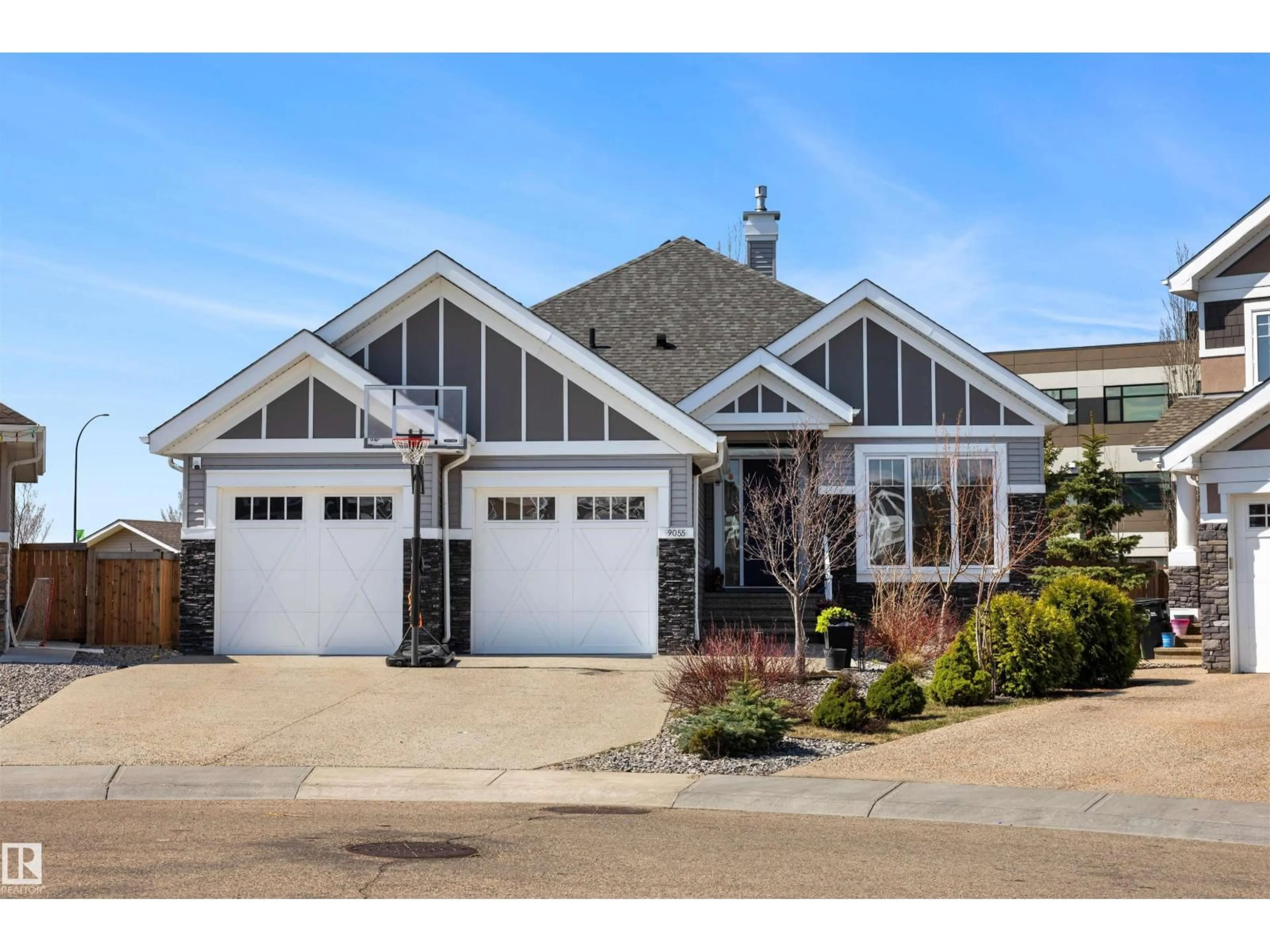 Home with vinyl exterior material, street for 9055 24 AV, Edmonton Alberta T6X0P4