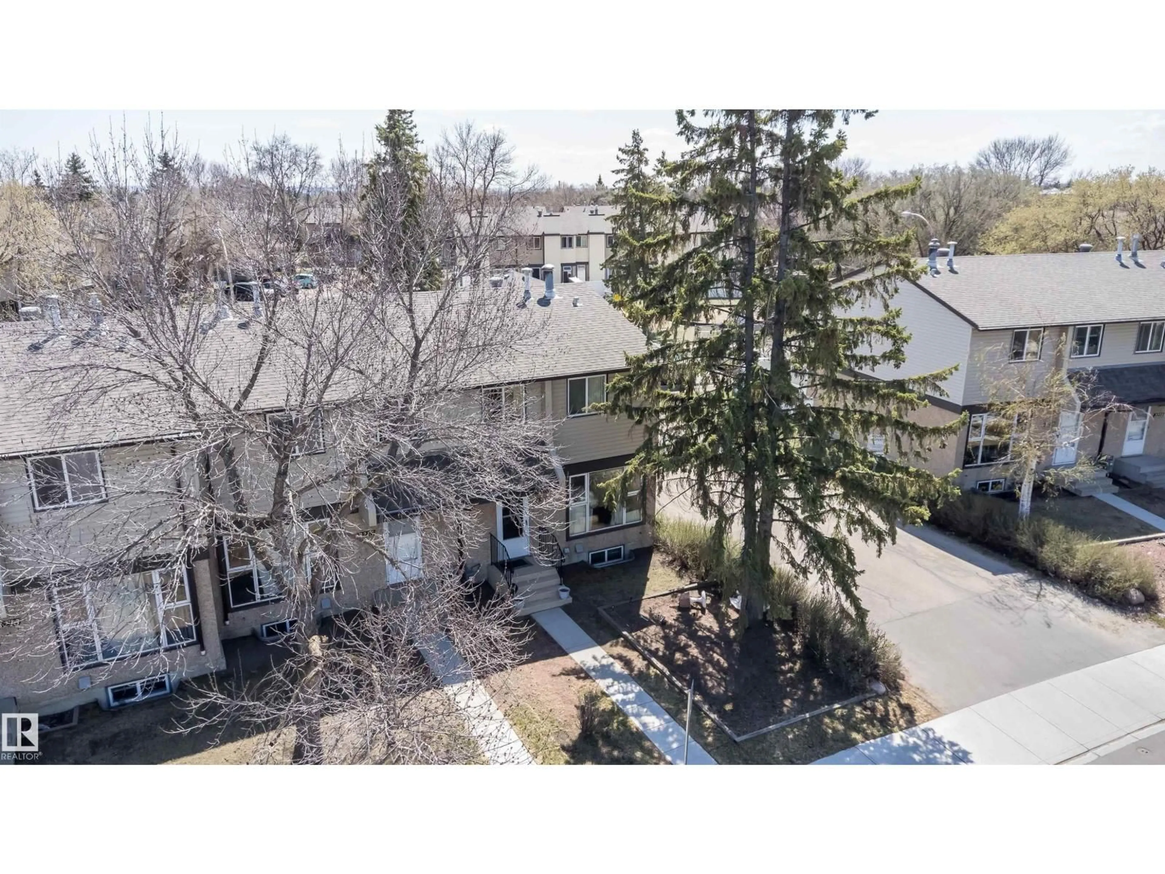 A pic from outside/outdoor area/front of a property/back of a property/a pic from drone, unknown for 3217 142 AV, Edmonton Alberta T5Y1H9