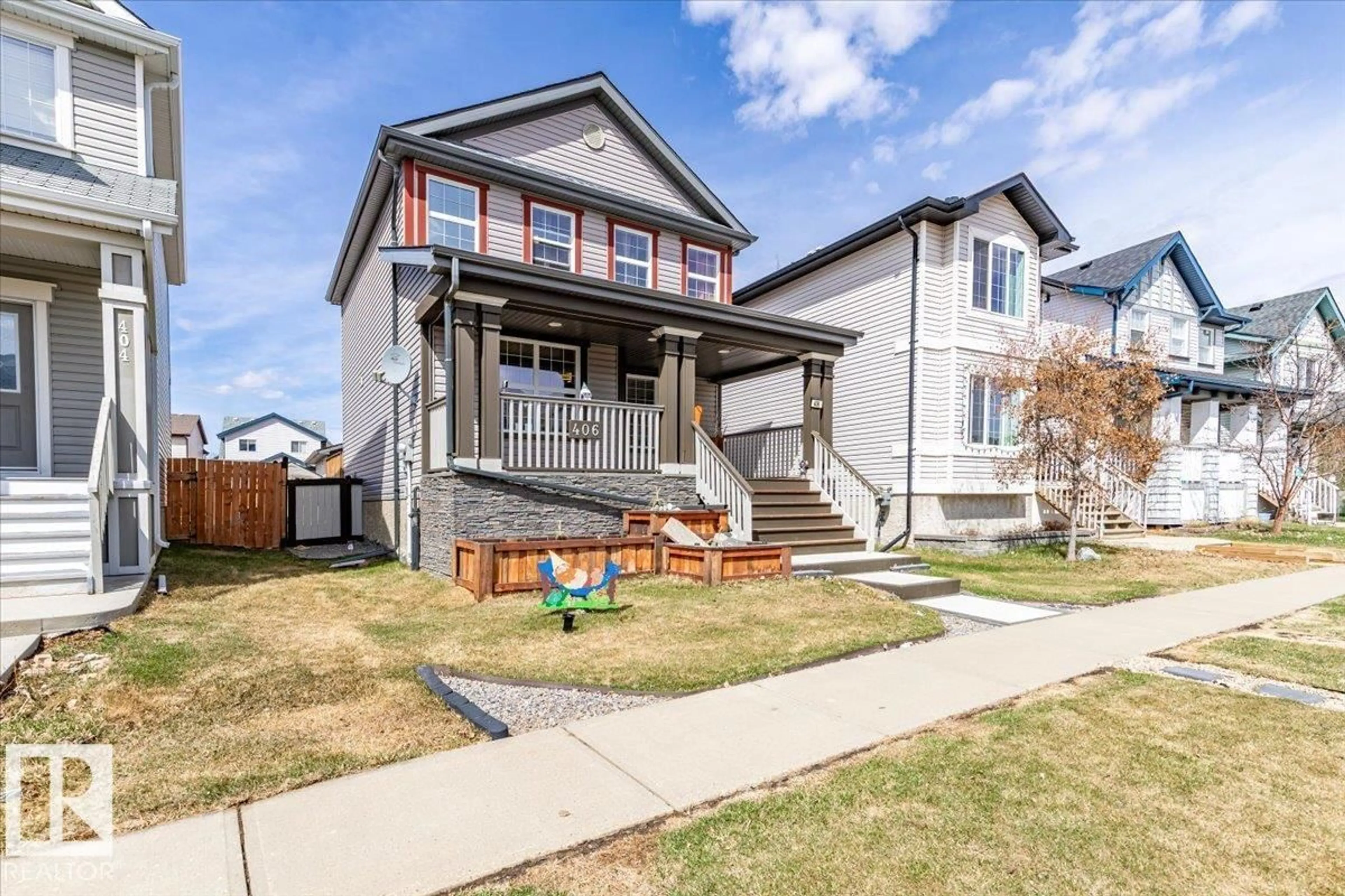 Home with vinyl exterior material, street for 406 SONGHURST PL, Leduc Alberta T9E0P7
