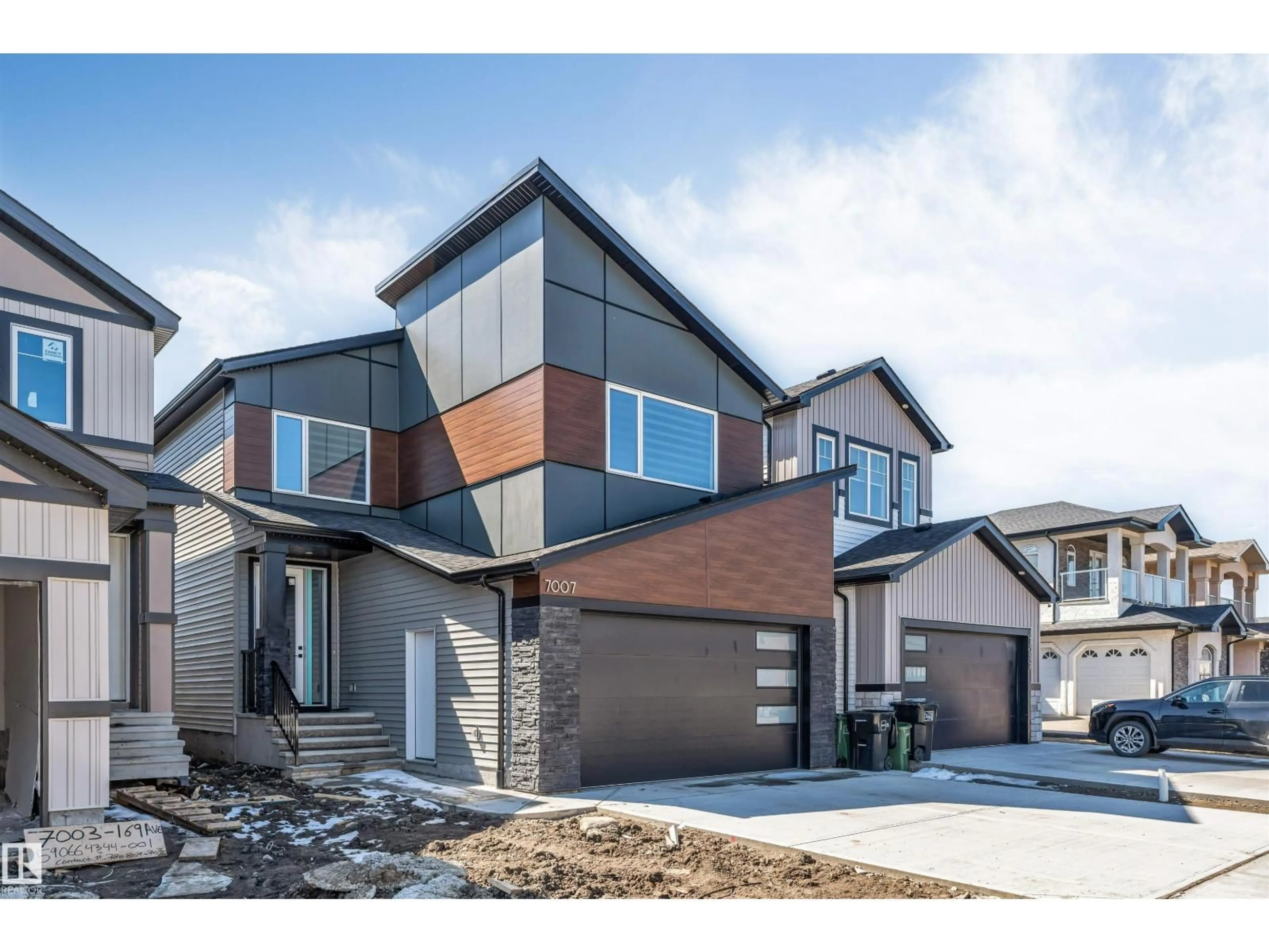Home with vinyl exterior material, street for 7007 169 AV, Edmonton Alberta T5Z0H2