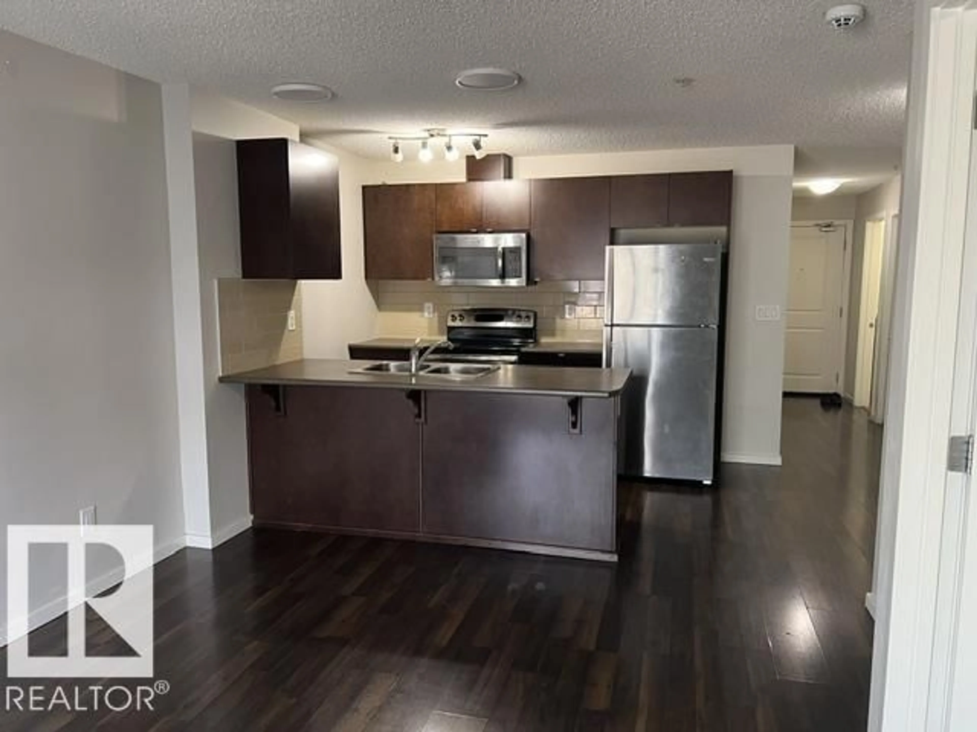 Open concept kitchen, unknown for #118 - 3357 16A AV, Edmonton Alberta T6T0V4