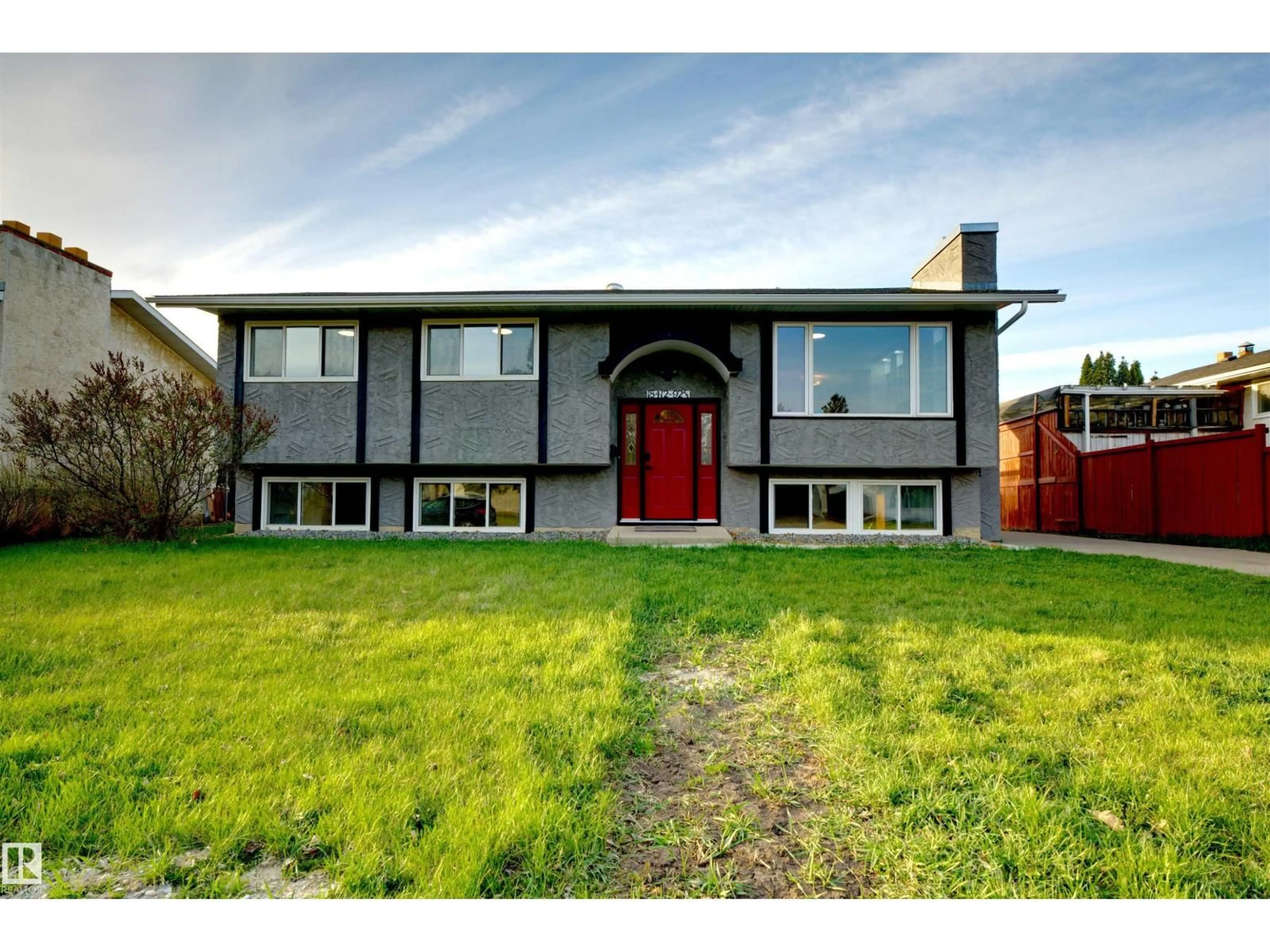 Home with vinyl exterior material, street for 18412 92 AV, Edmonton Alberta T5T2R2