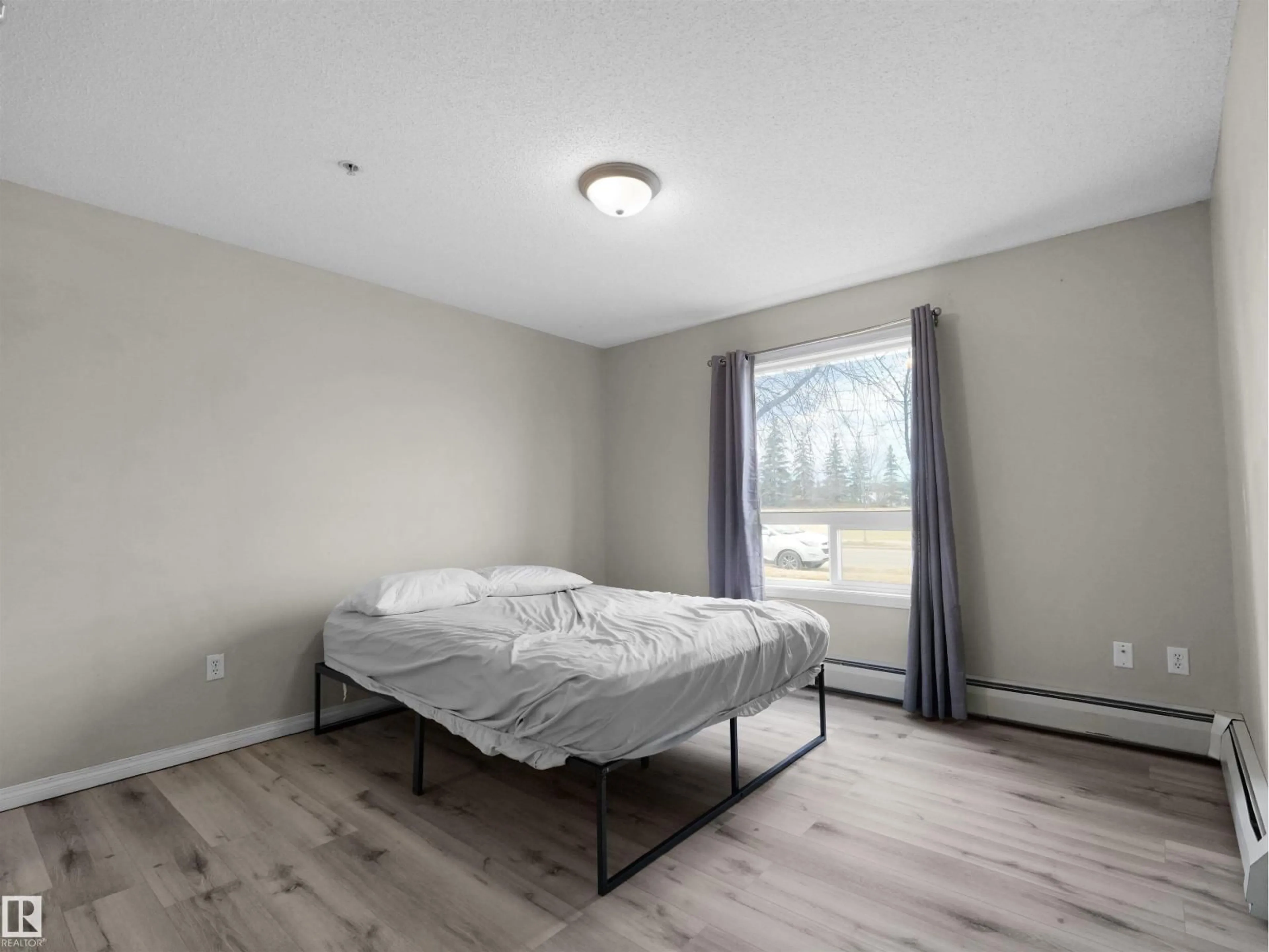 Bedroom with bed, wood/laminate floor for 7327 - 7123 SOUTH TERWILLEGAR DR, Edmonton Alberta T6R0L8