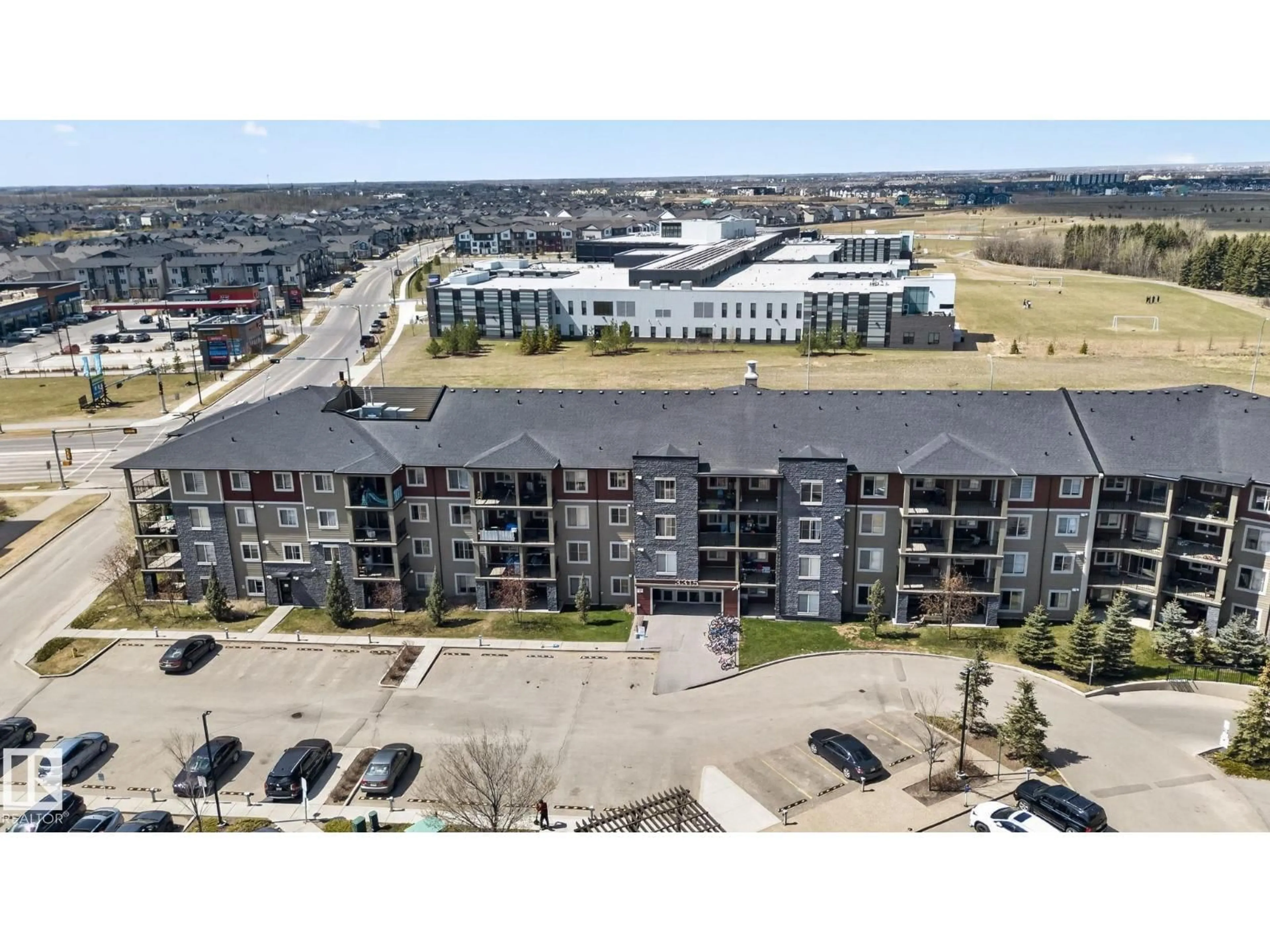 A pic from outside/outdoor area/front of a property/back of a property/a pic from drone, unknown for #412 - 3315 JAMES MOWATT TR, Edmonton Alberta T6W3L9