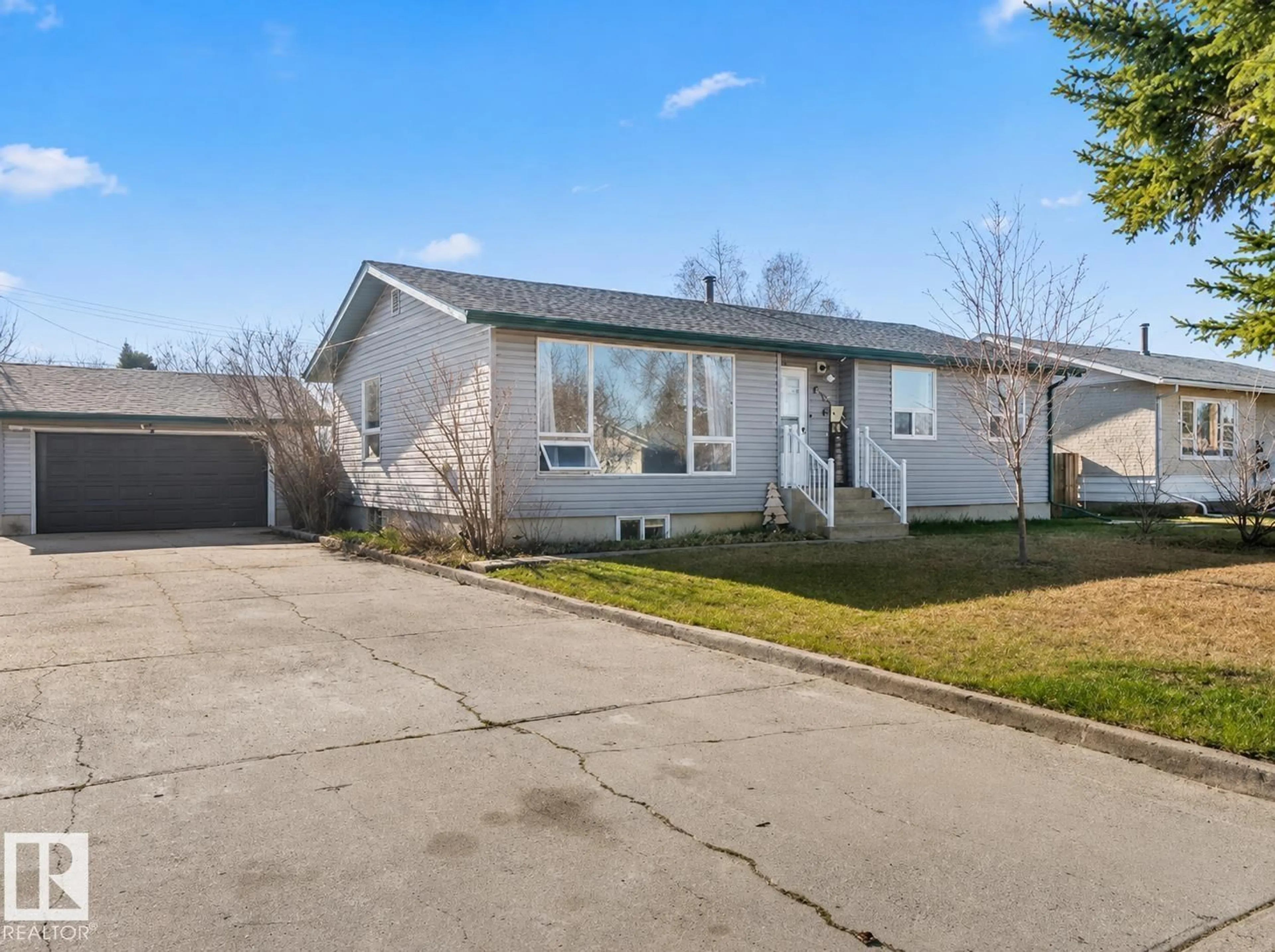 Home with vinyl exterior material, street for 4908 59 ST, Cold Lake Alberta T9M1T2