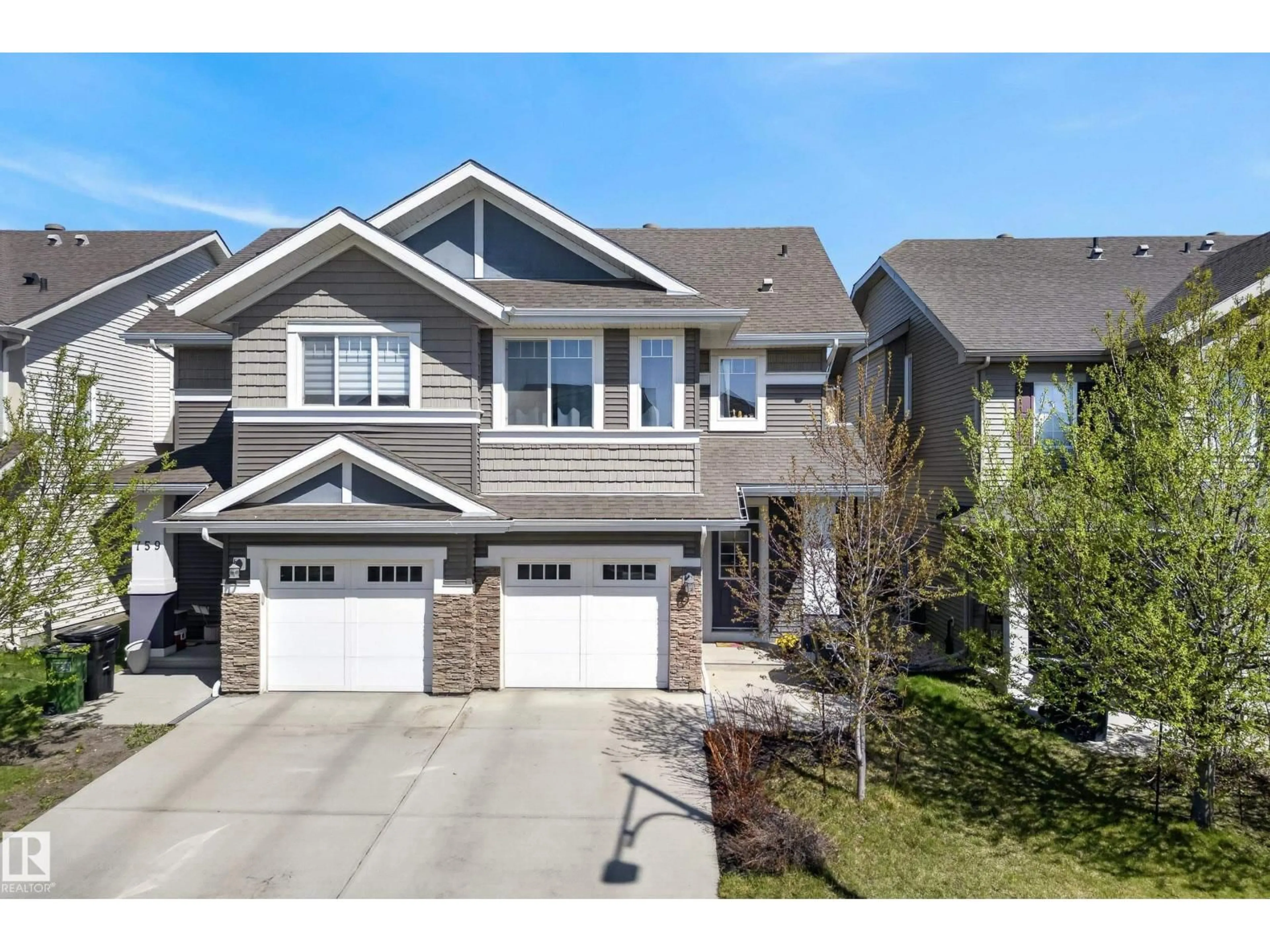 Home with vinyl exterior material, street for 757 EAGLESON CR, Edmonton Alberta T6M0T8