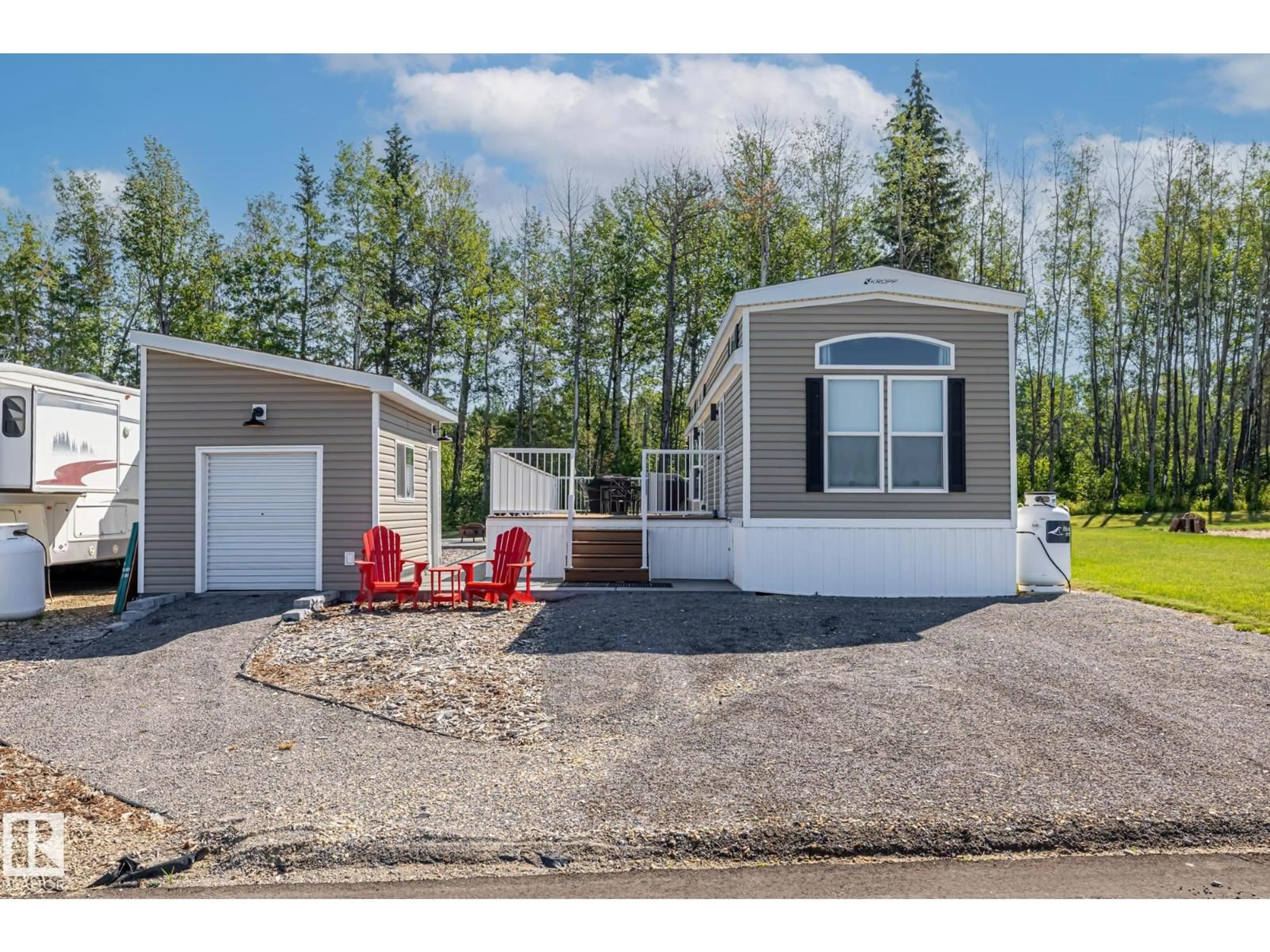 Home with vinyl exterior material, street for 53126 - 565 RGE ROAD 70, Rural Parkland County Alberta T7Z1M1