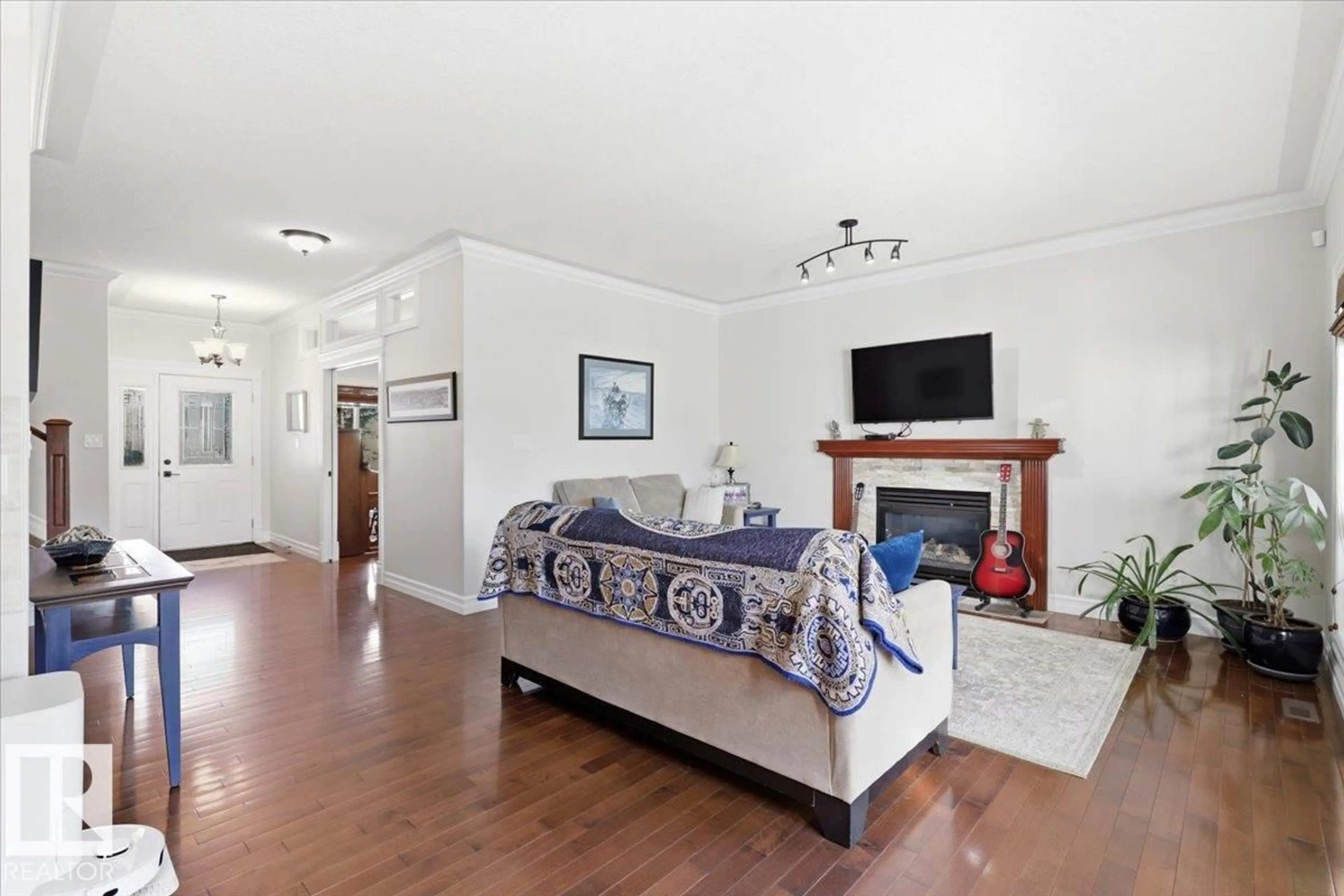 Living room with furniture, wood/laminate floor for 30 RAVINE DR, Devon Alberta T9G0A1