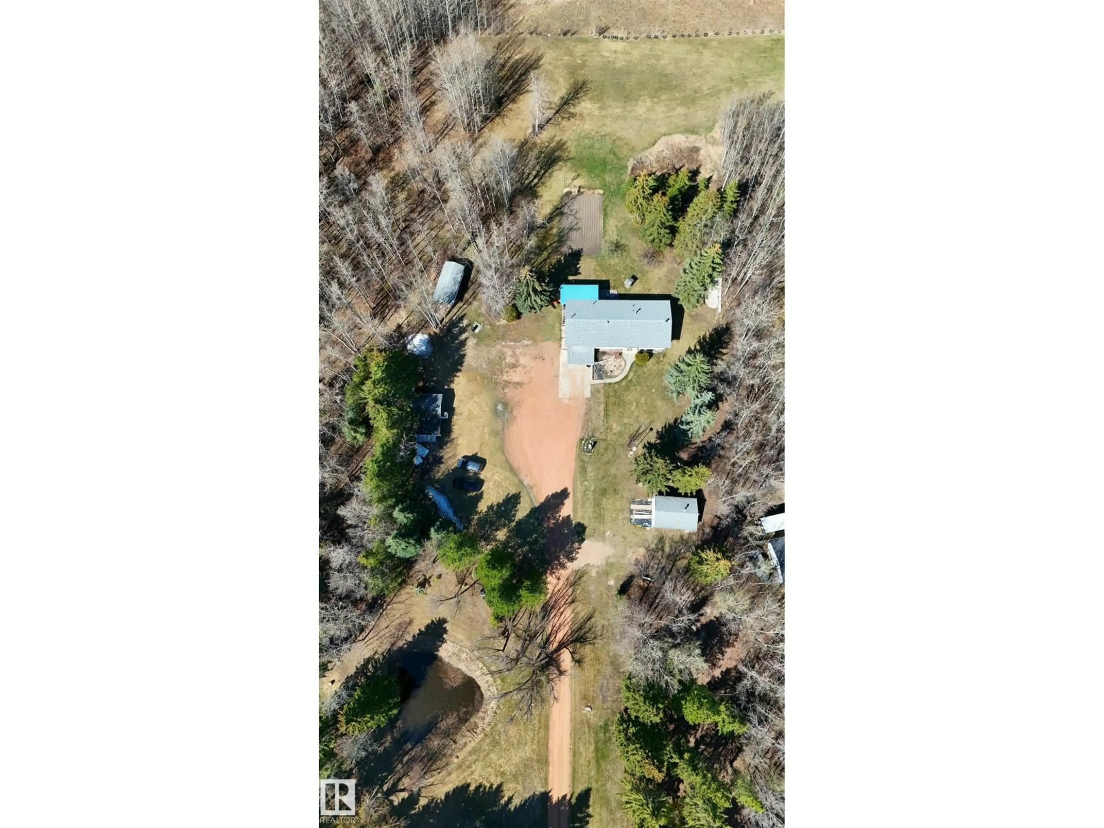 A pic from outside/outdoor area/front of a property/back of a property/a pic from drone, forest/trees view for 4701 22 ST, Rural Wetaskiwin County Alberta T0C2C0