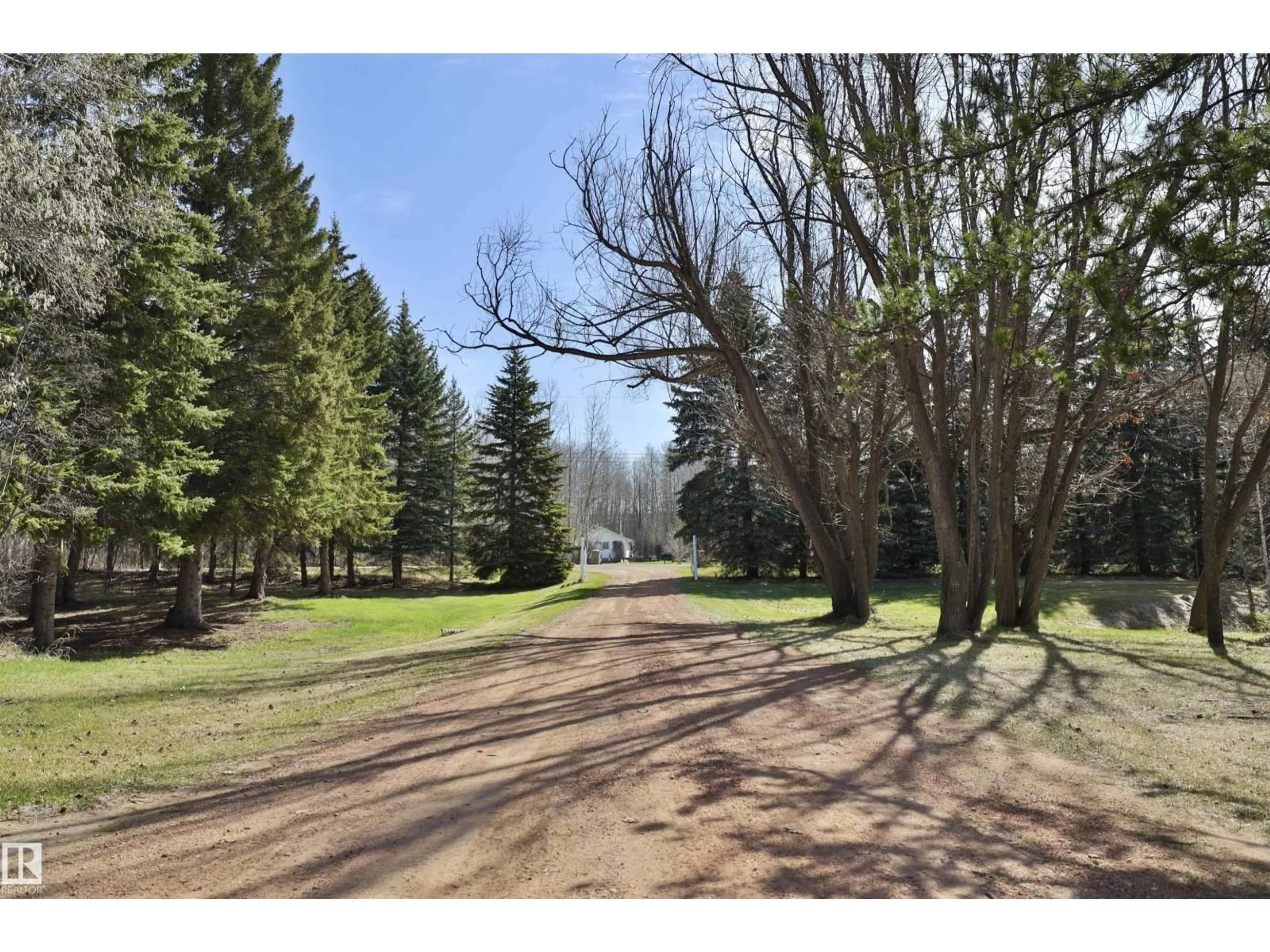 A pic from outside/outdoor area/front of a property/back of a property/a pic from drone, forest/trees view for 4701 22 ST, Rural Wetaskiwin County Alberta T0C2C0