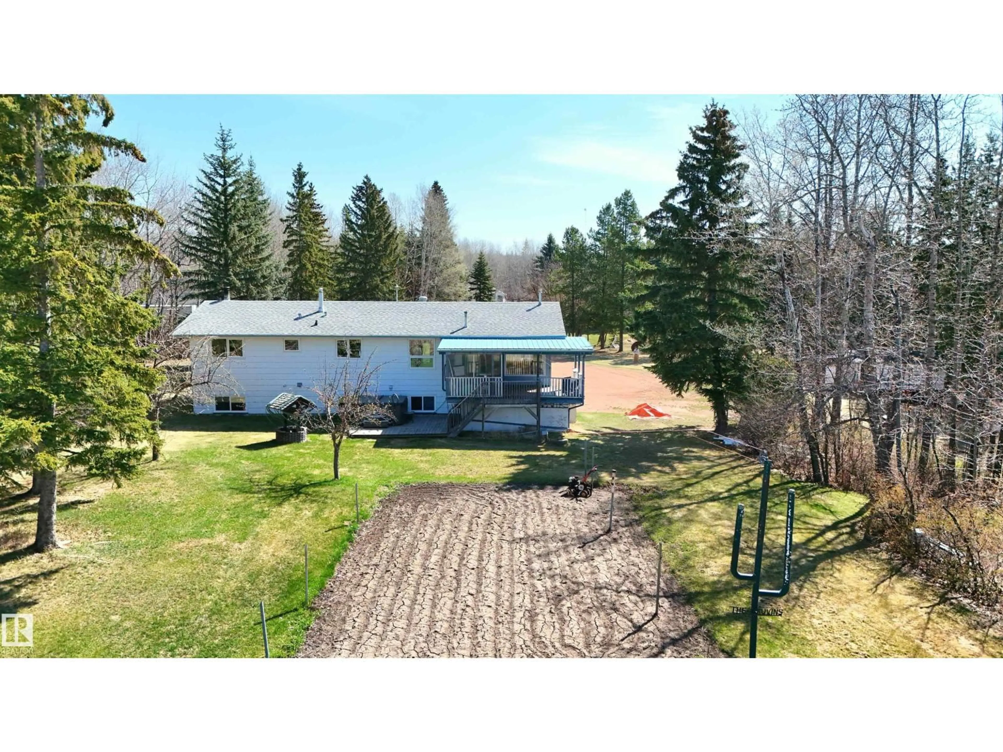 A pic from outside/outdoor area/front of a property/back of a property/a pic from drone, mountain view for 4701 22 ST, Rural Wetaskiwin County Alberta T0C2C0