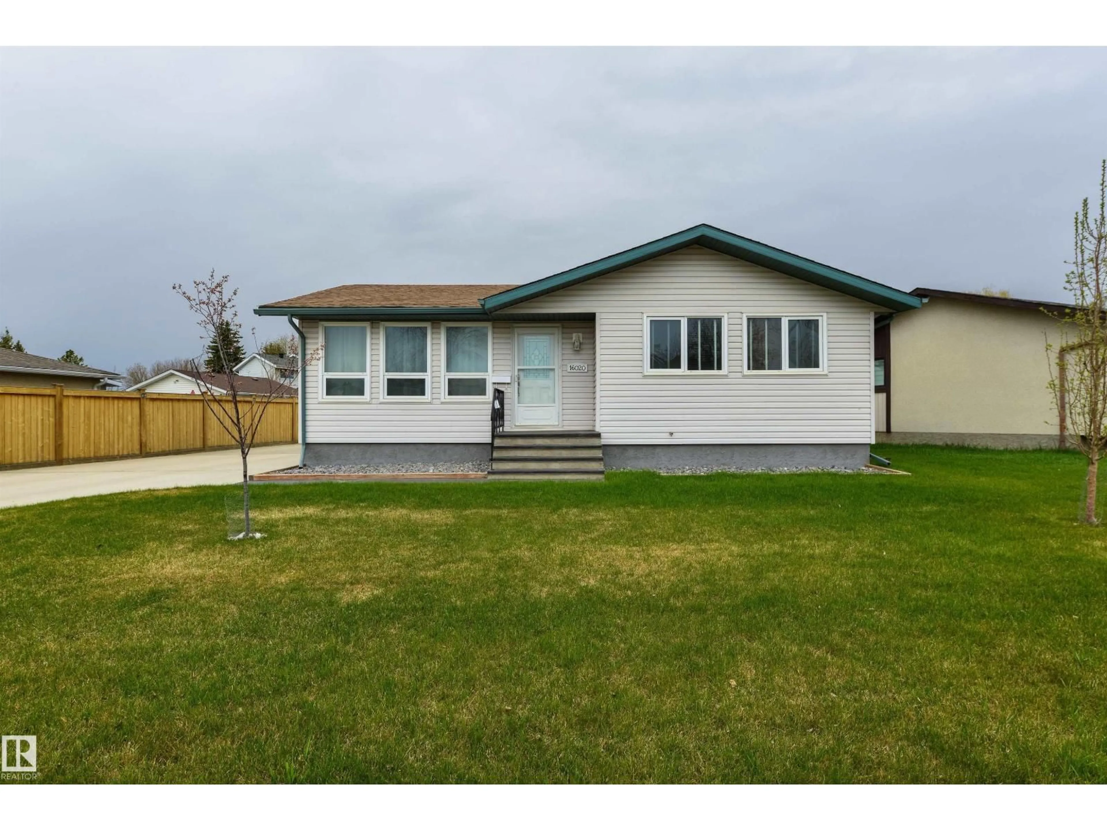 Home with vinyl exterior material, street for NW - 16020 123 ST, Edmonton Alberta T5X2W5