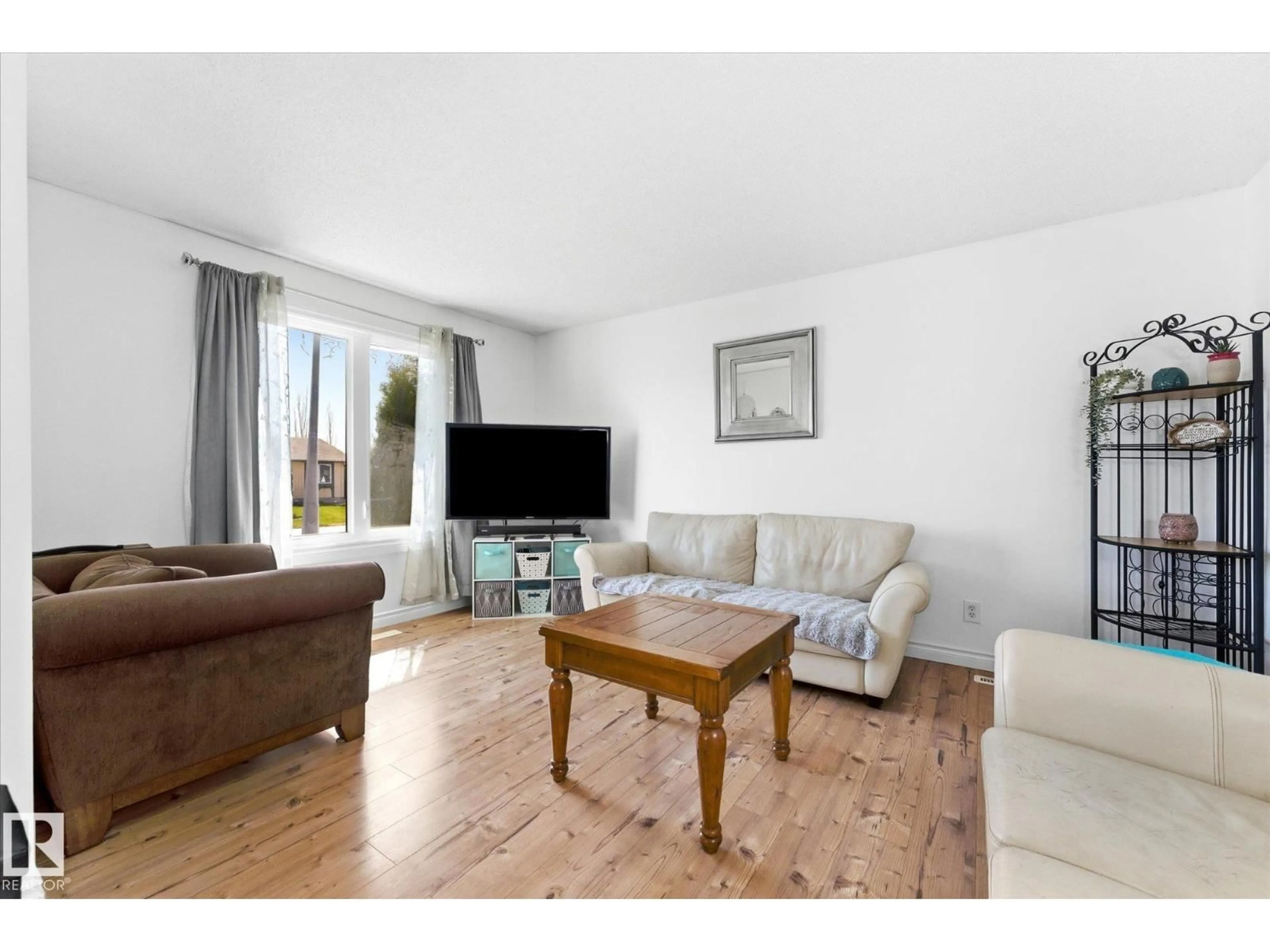 Living room with furniture, wood/laminate floor for 5702 50 ST, Stony Plain Alberta T7Z1A8