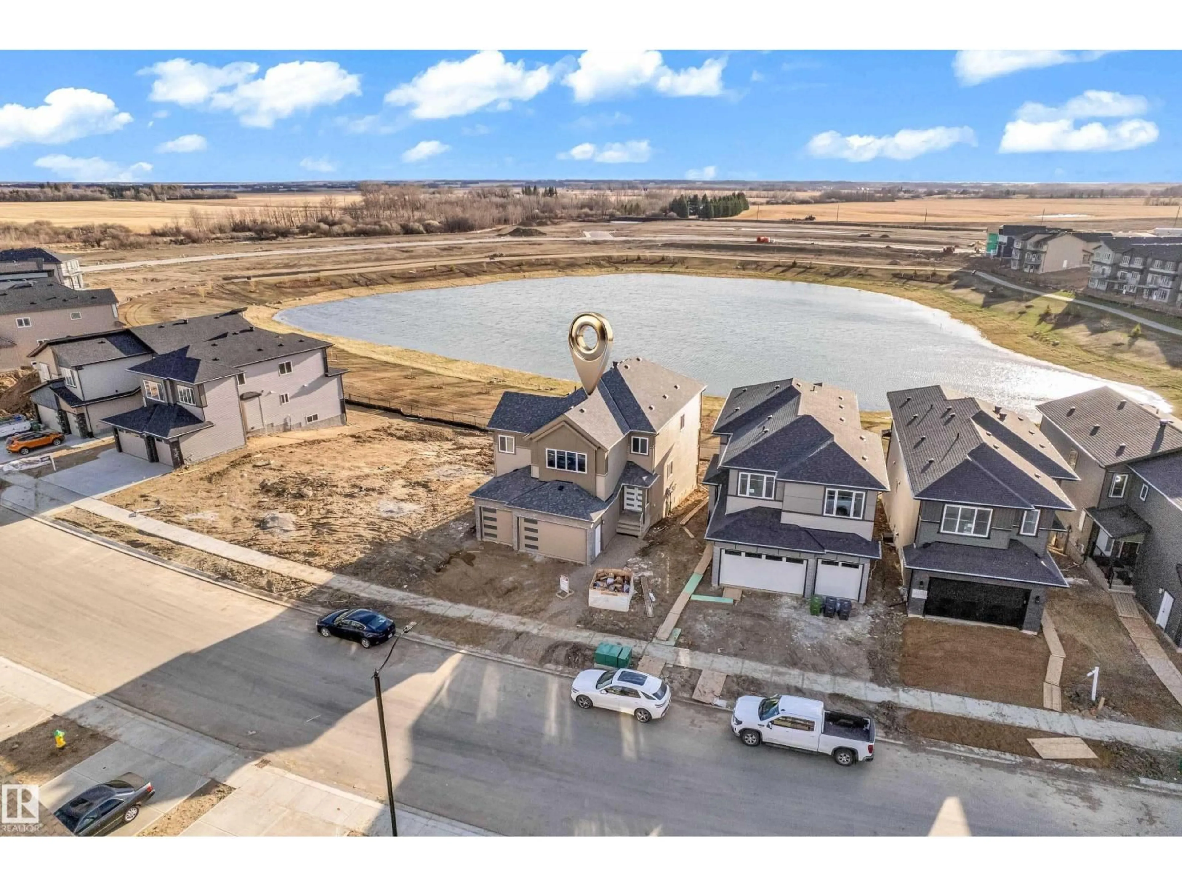 A pic from outside/outdoor area/front of a property/back of a property/a pic from drone, water/lake/river/ocean view for 213 CRYSTAL CREEK, Leduc Alberta T9E0X6