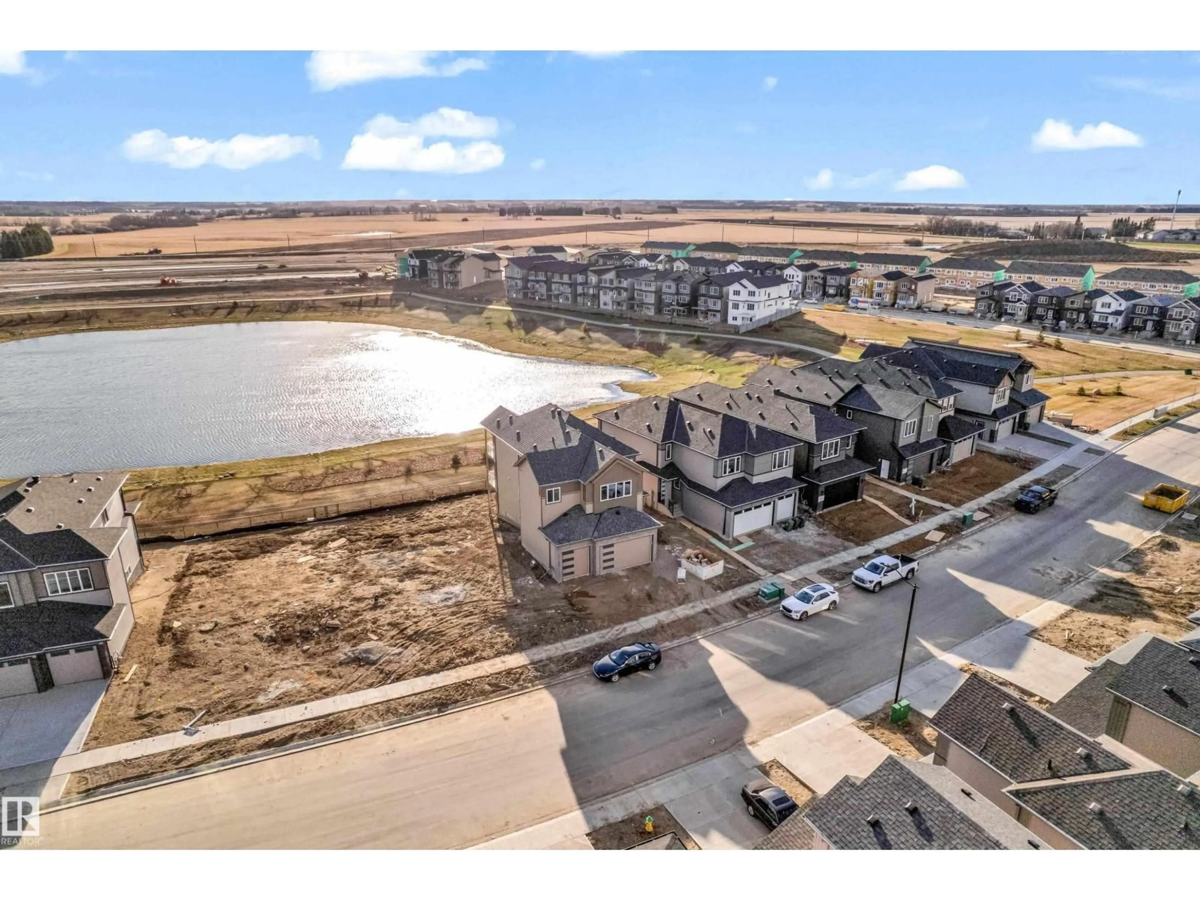 A pic from outside/outdoor area/front of a property/back of a property/a pic from drone, water/lake/river/ocean view for 213 CRYSTAL CREEK, Leduc Alberta T9E0X6