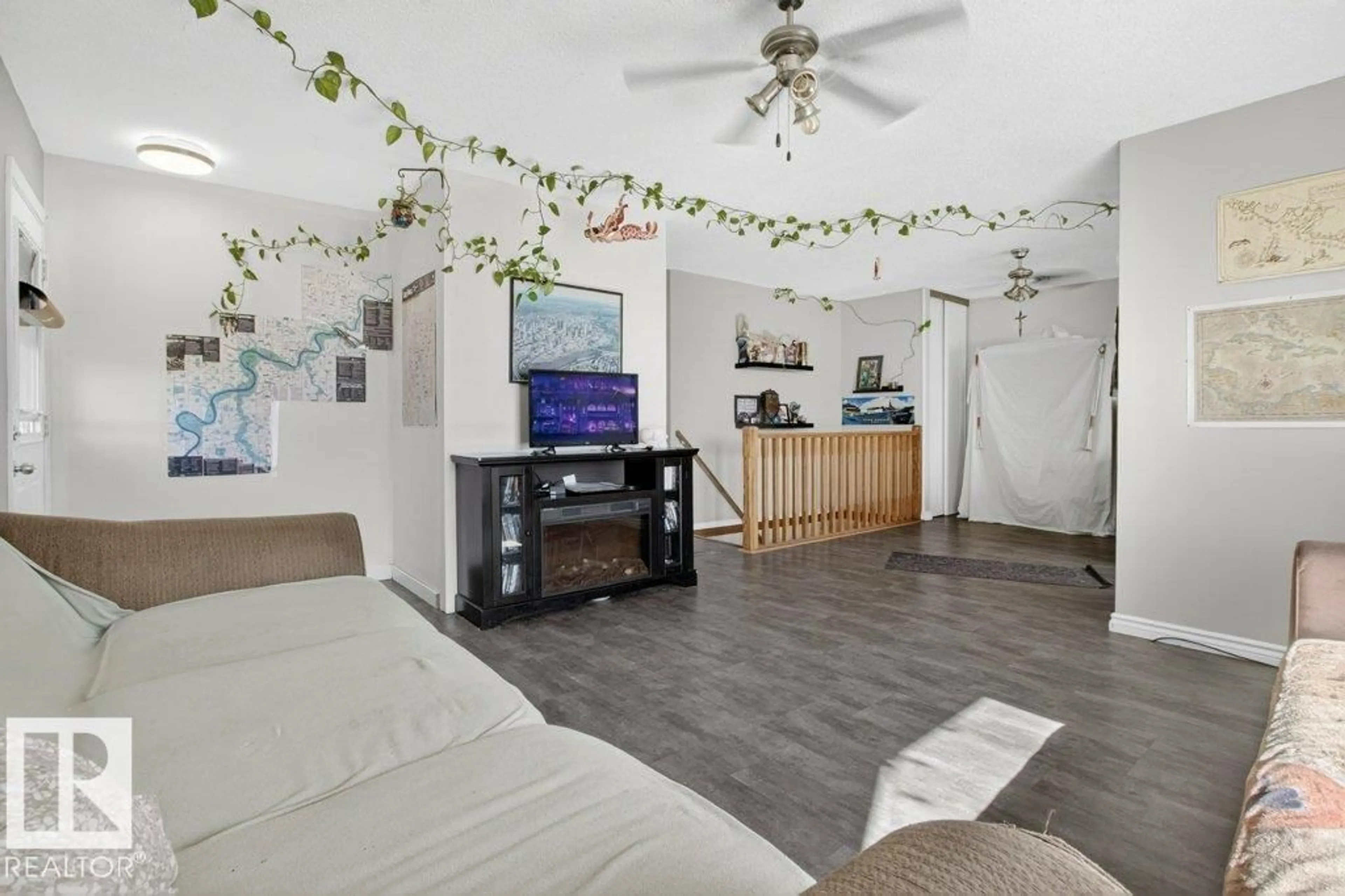 Living room with furniture, unknown for NW - 2104 145 AV, Edmonton Alberta T5Y1T9