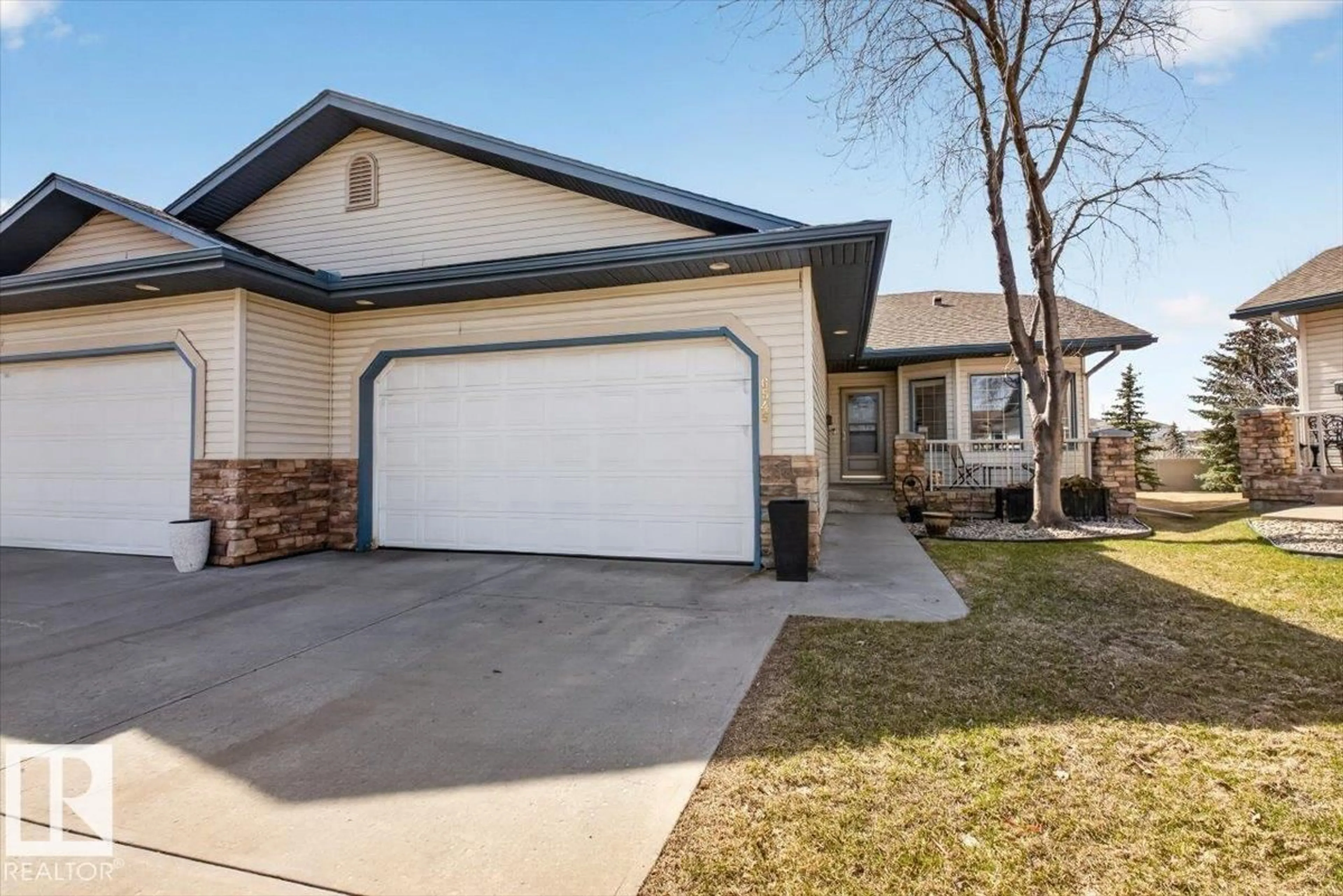 Home with vinyl exterior material, street for NW - 6545 199 ST, Edmonton Alberta T5T6W1