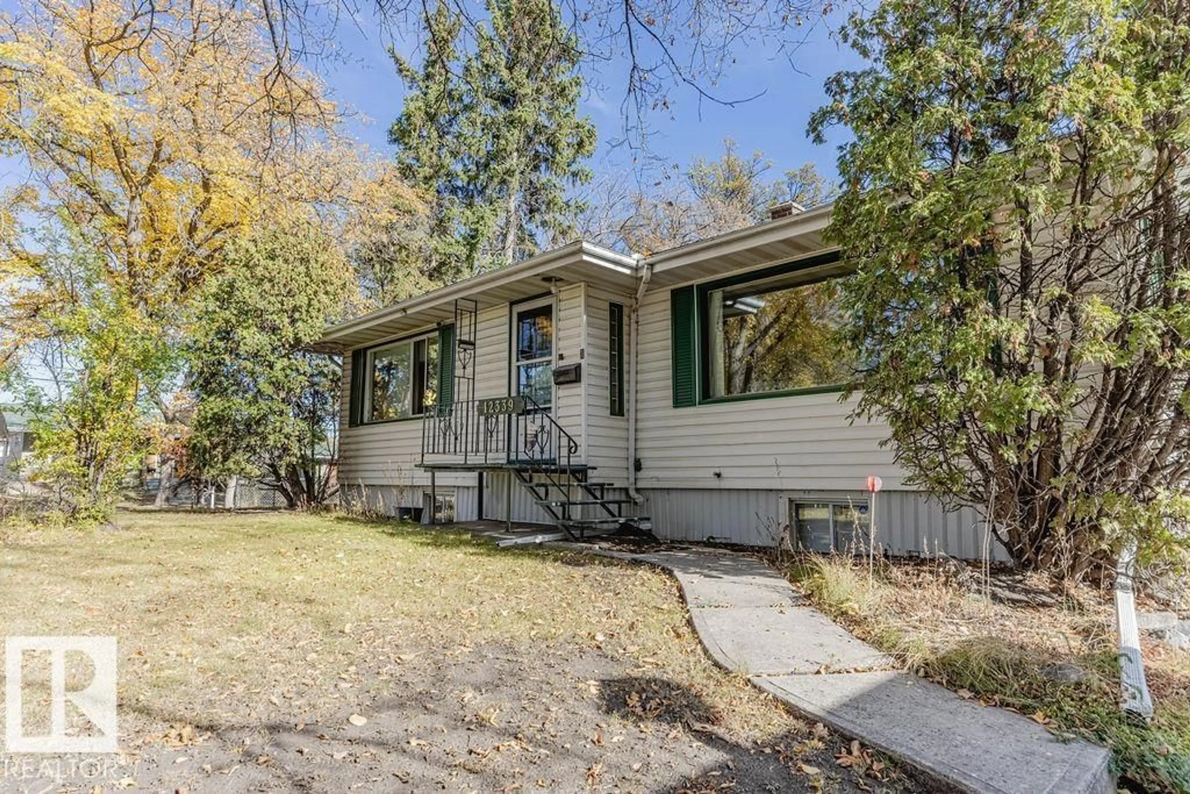 Home with vinyl exterior material, street for 12339 89 ST, Edmonton Alberta T5B3W8