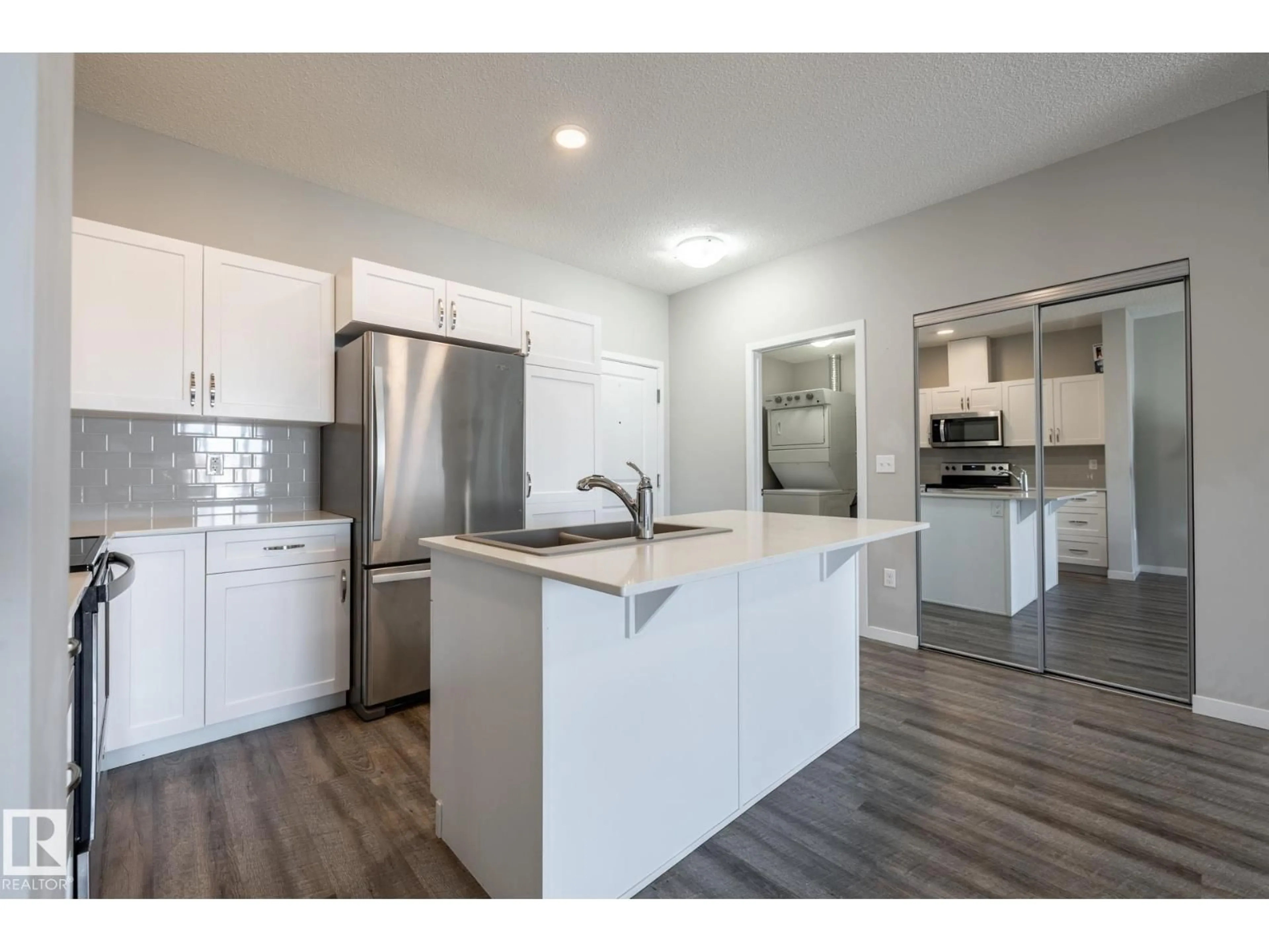 Open concept kitchen, wood/laminate floor for 1818 - 447 RUTHERFORD RD, Edmonton Alberta T6W2K6