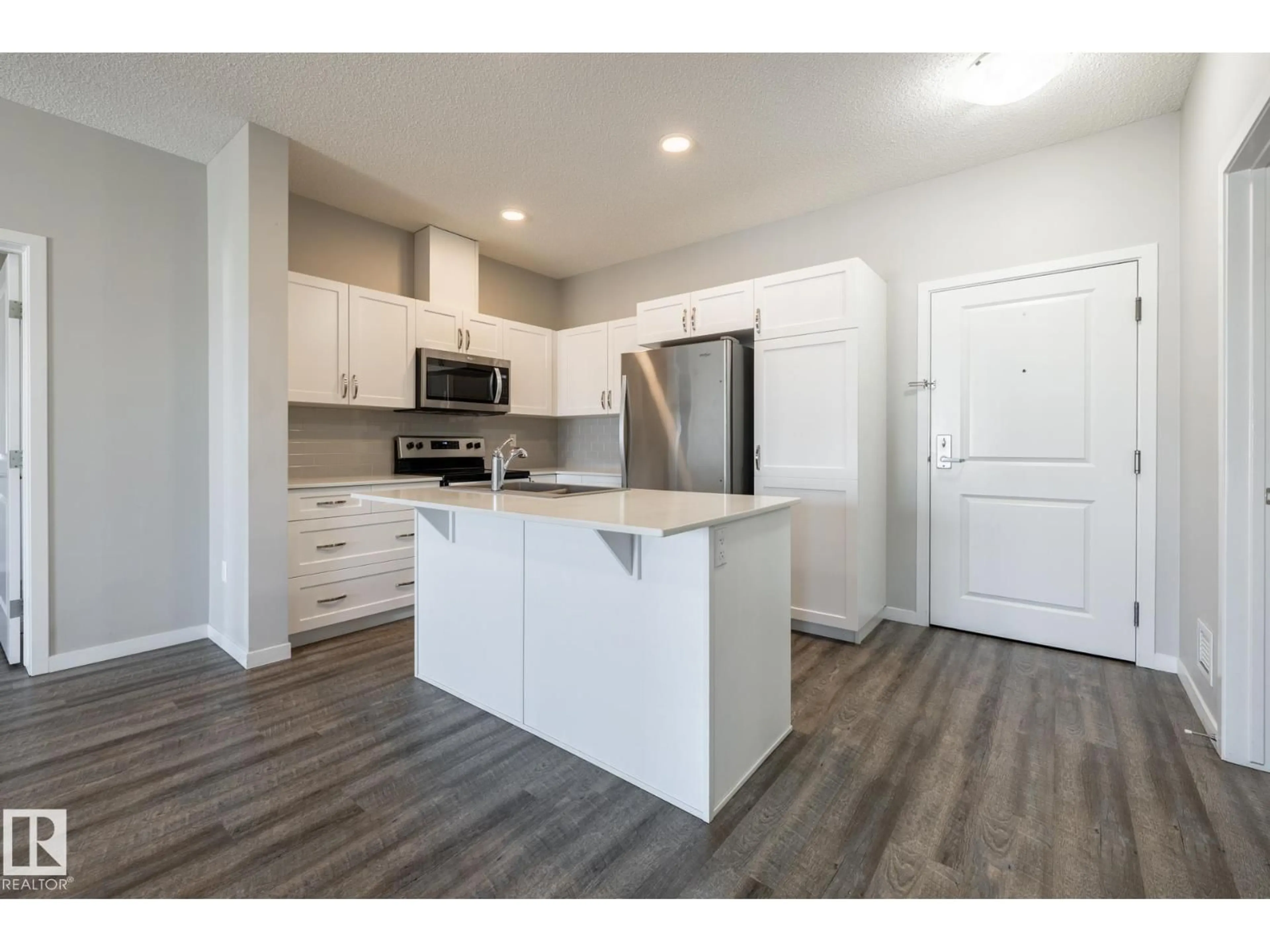 Open concept kitchen, wood/laminate floor for 1818 - 447 RUTHERFORD RD, Edmonton Alberta T6W2K6