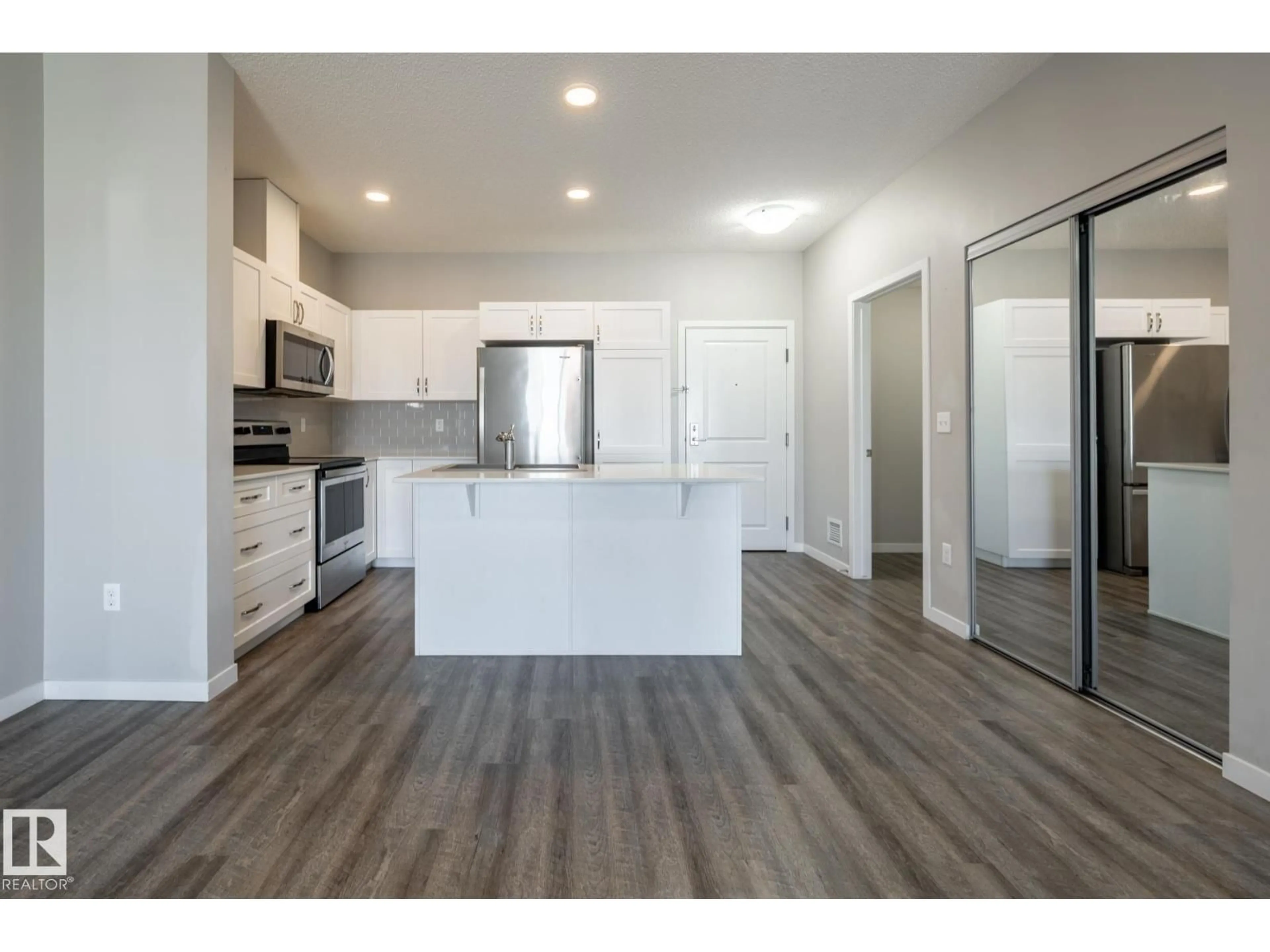 Open concept kitchen, wood/laminate floor for 1818 - 447 RUTHERFORD RD, Edmonton Alberta T6W2K6