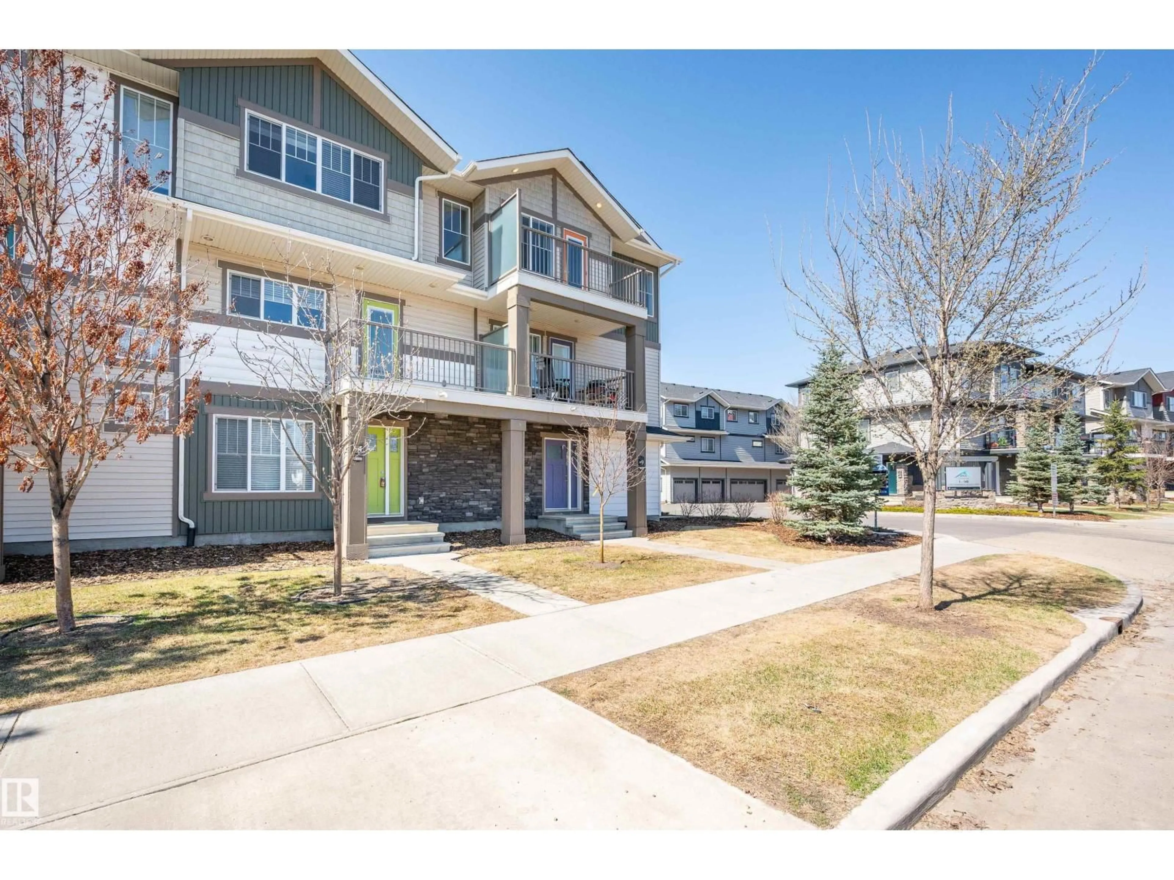 A pic from outside/outdoor area/front of a property/back of a property/a pic from drone, street for #8 - 1530 TAMARACK BV, Edmonton Alberta T6T2E6