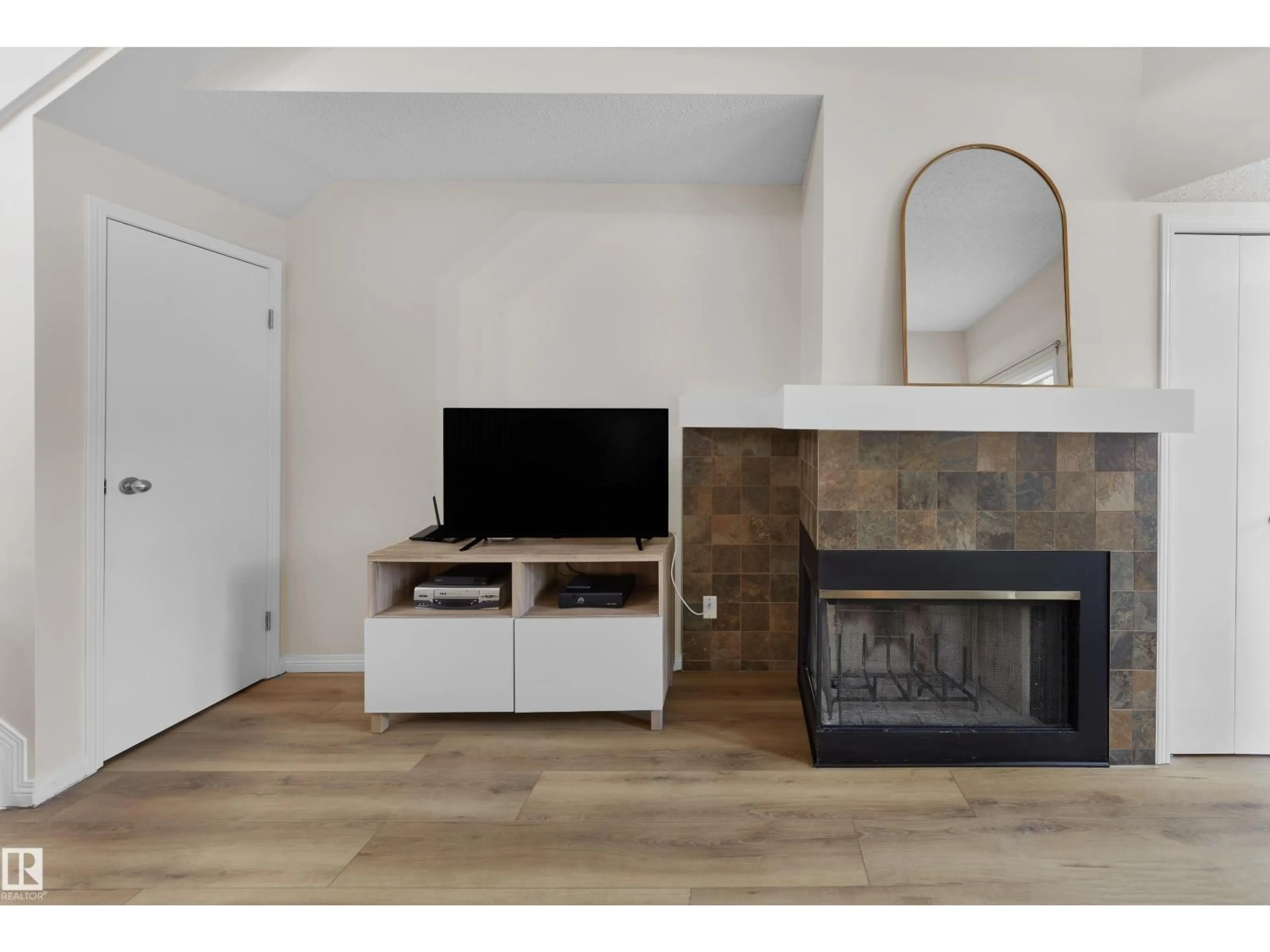Living room with furniture, wood/laminate floor for 11140 83 AV, Edmonton Alberta T6G0V1