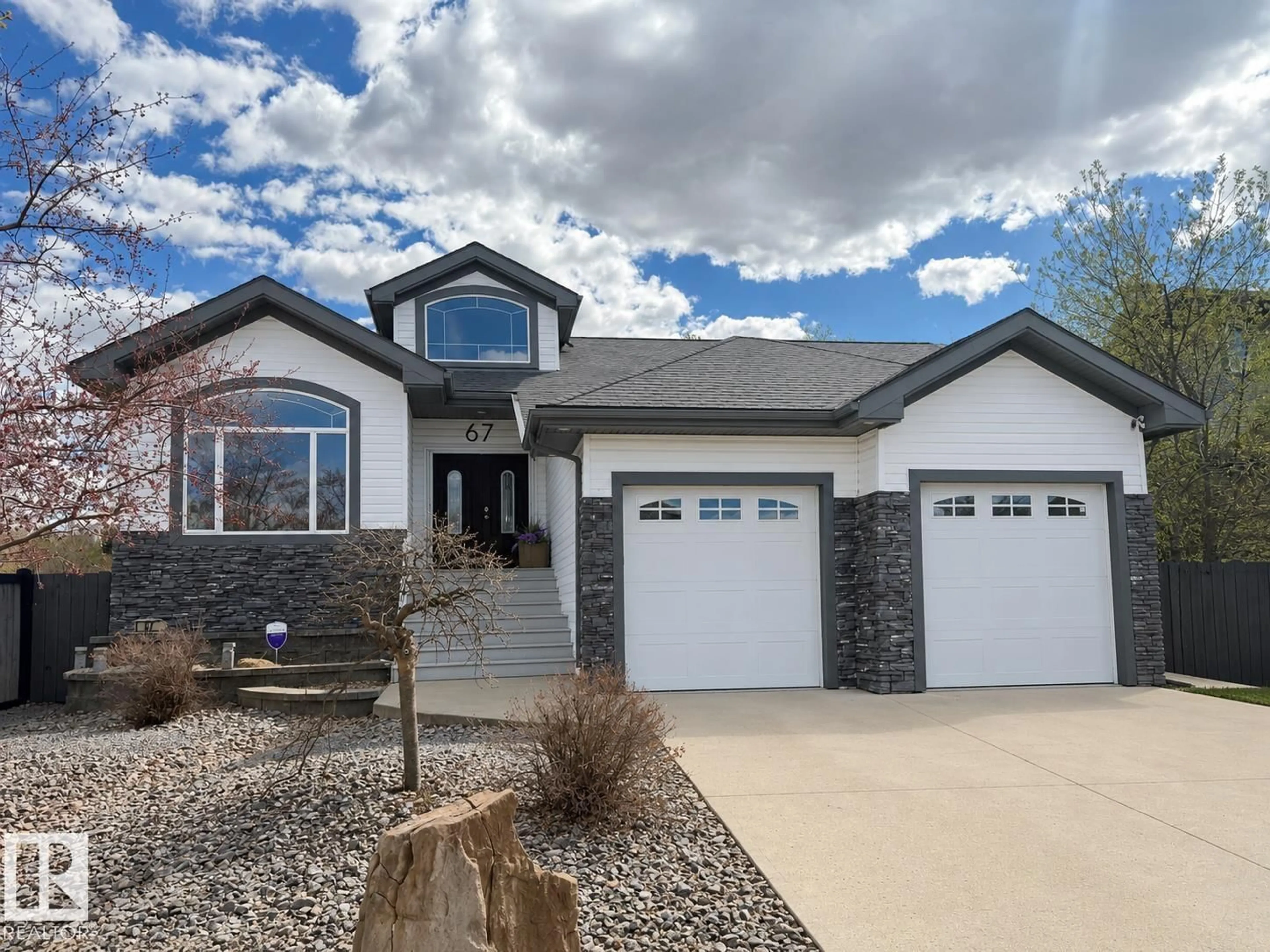 Home with vinyl exterior material, street for 67 SHORES DR, Leduc Alberta T9E8N7