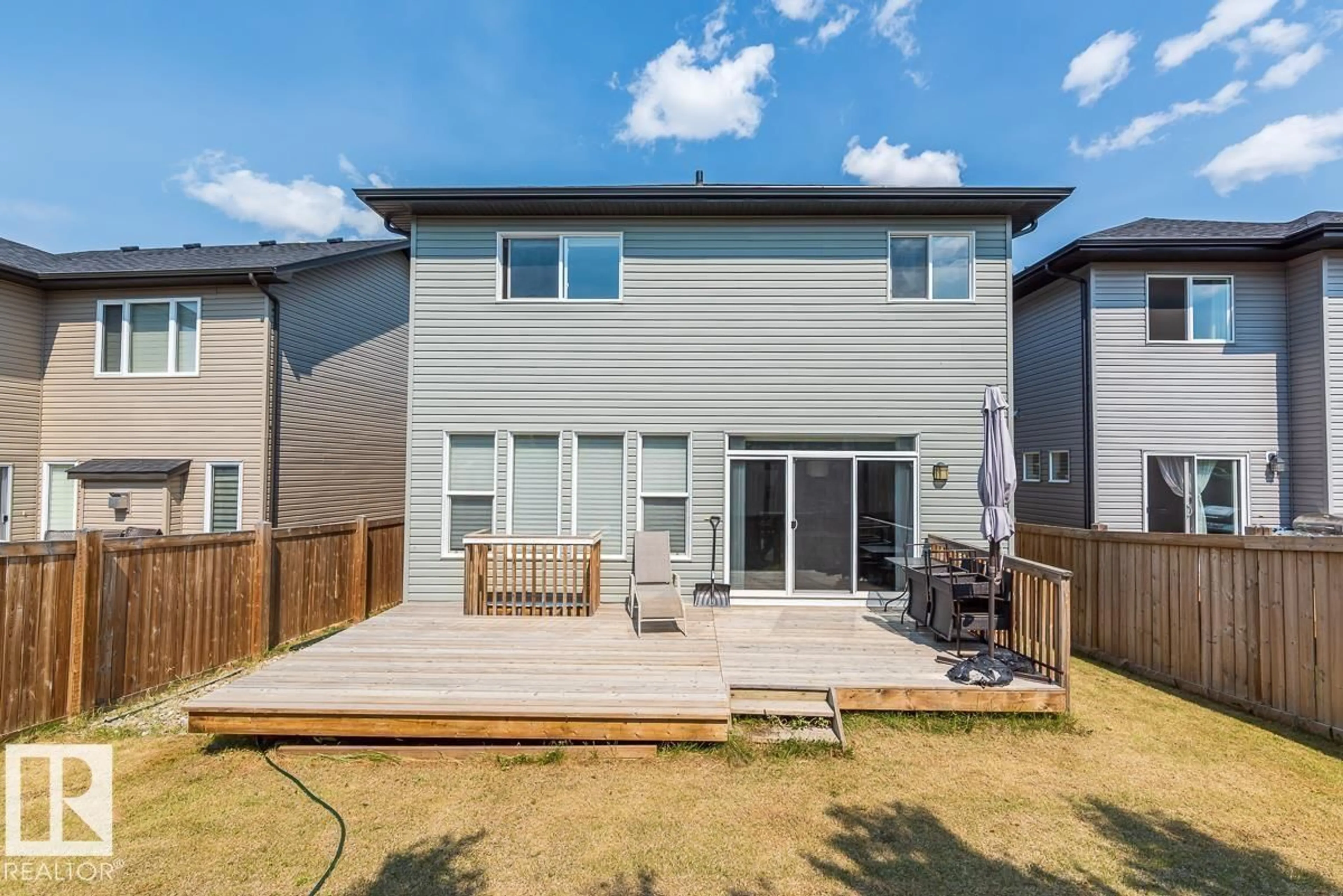 Home with vinyl exterior material, street for 9748 205 ST NW, Edmonton Alberta T5T4V7