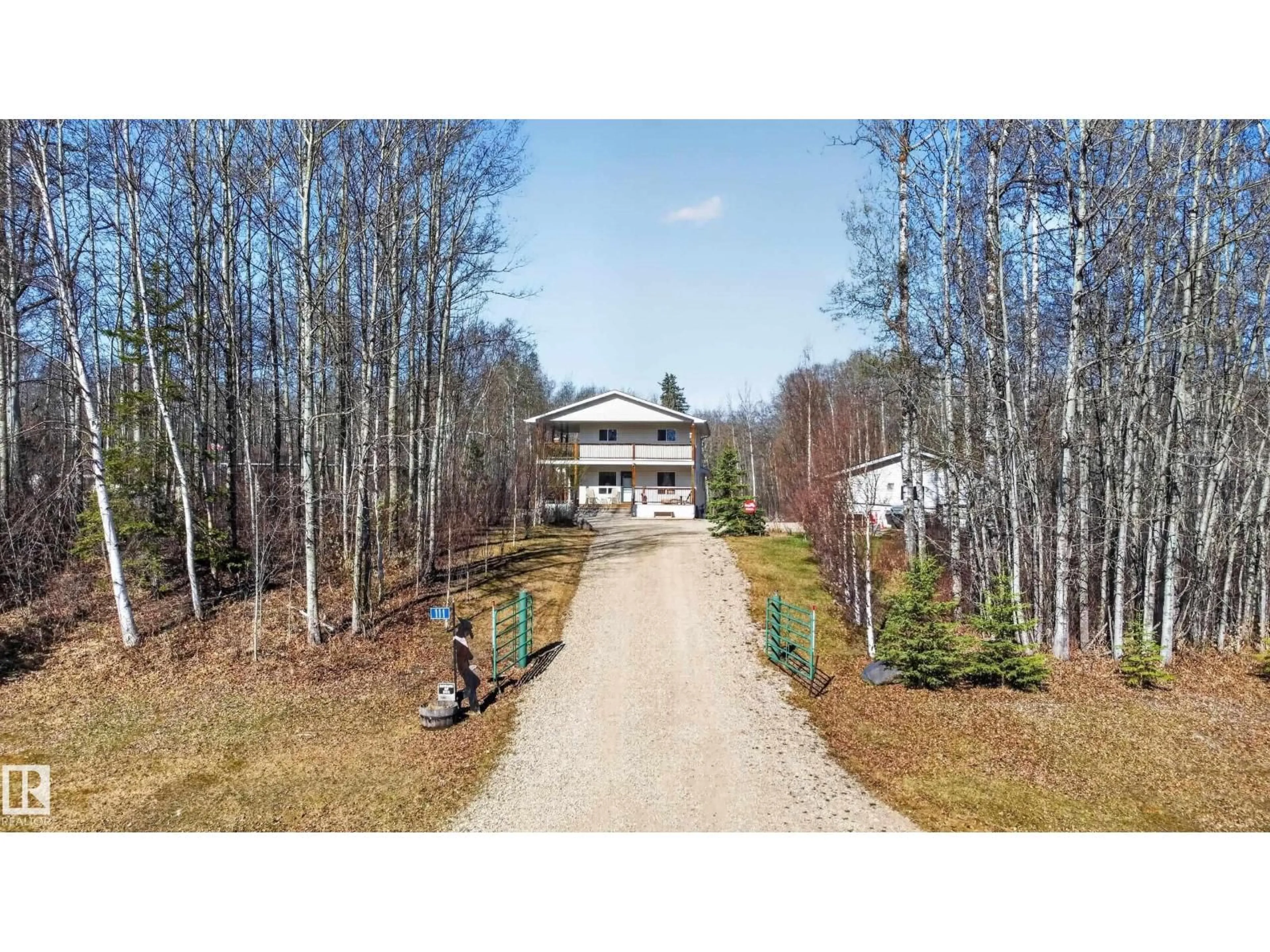 A pic from outside/outdoor area/front of a property/back of a property/a pic from drone, forest/trees view for #111 - 3406 TOWNSHIP ROAD 552, Rural Lac Ste. Anne County Alberta T0E1A0