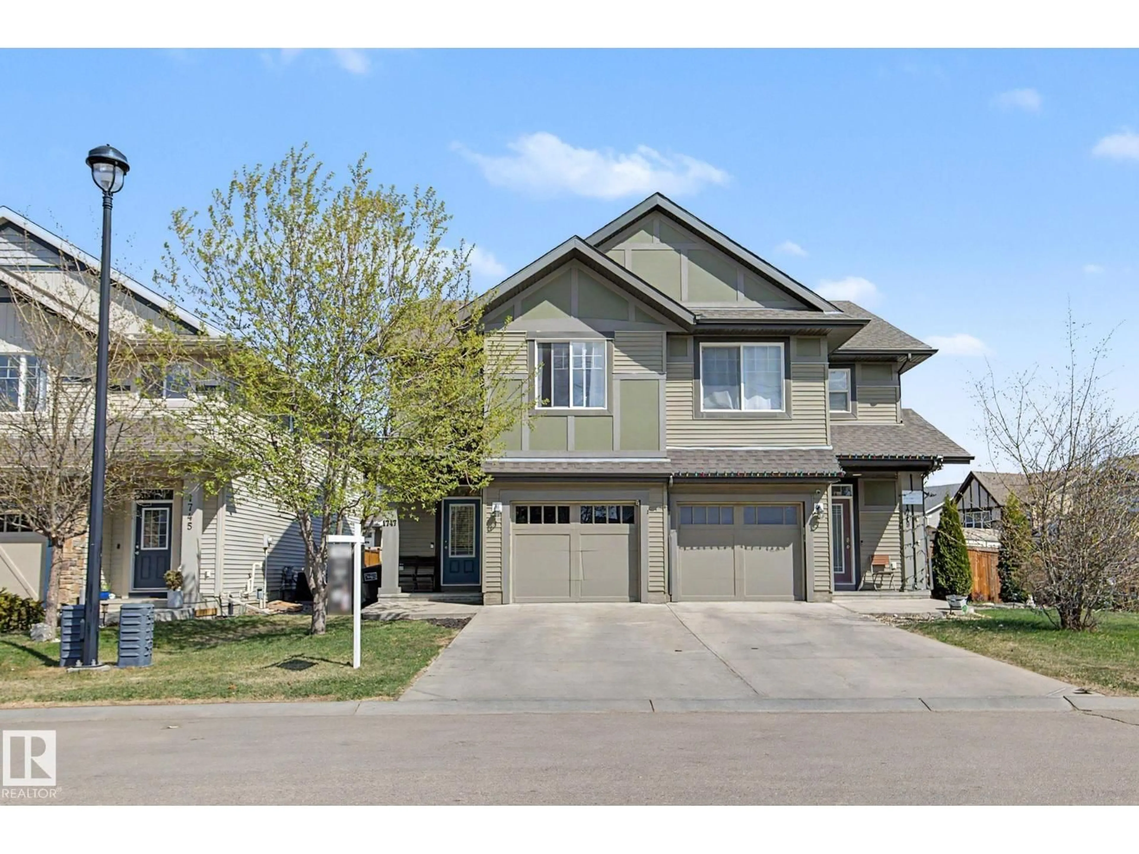Home with vinyl exterior material, street for 1747 CHAPMAN WY, Edmonton Alberta T6W2E8