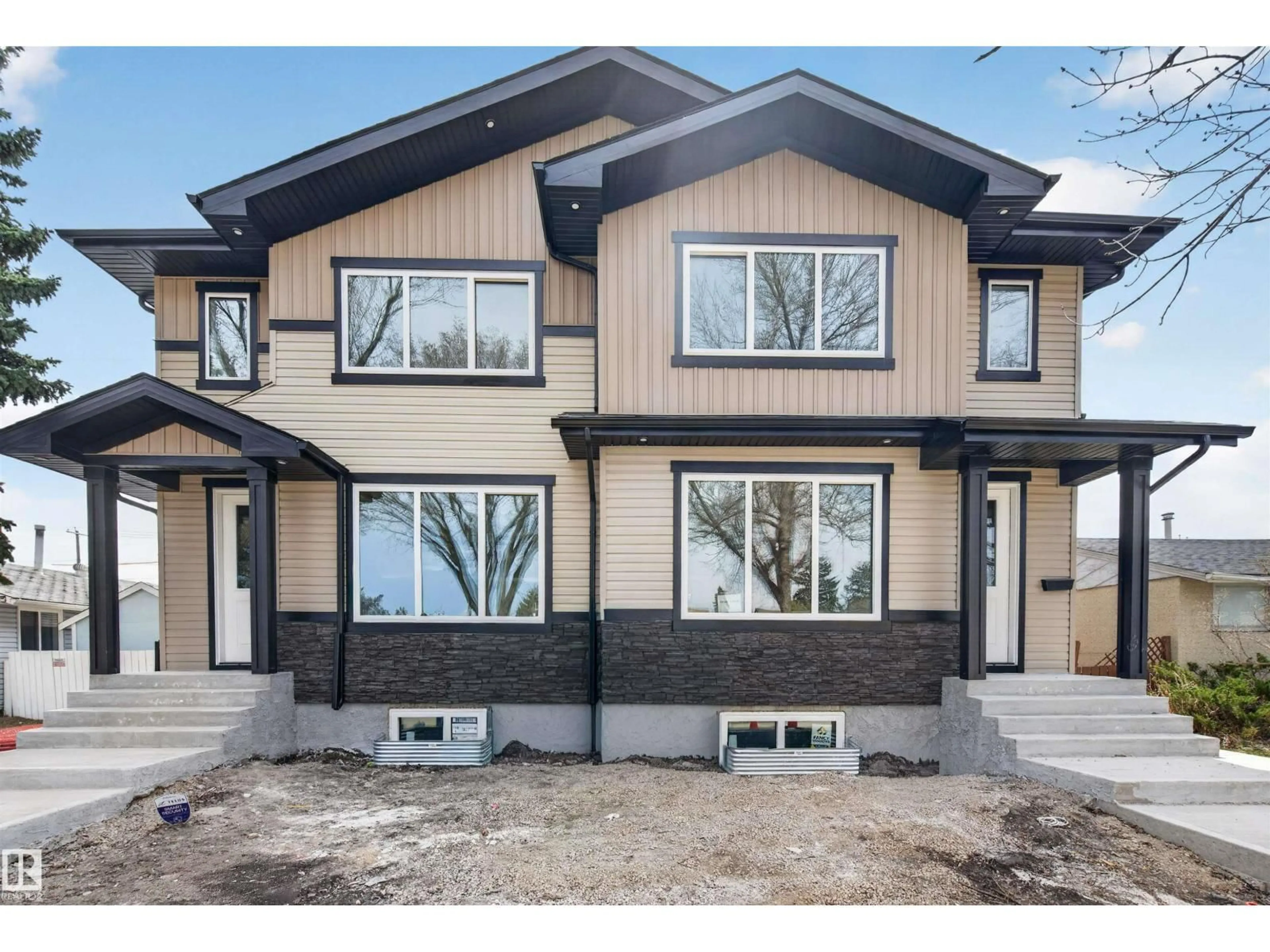 Home with brick exterior material, street for 10707-09 128 AV, Edmonton Alberta T5E0J4