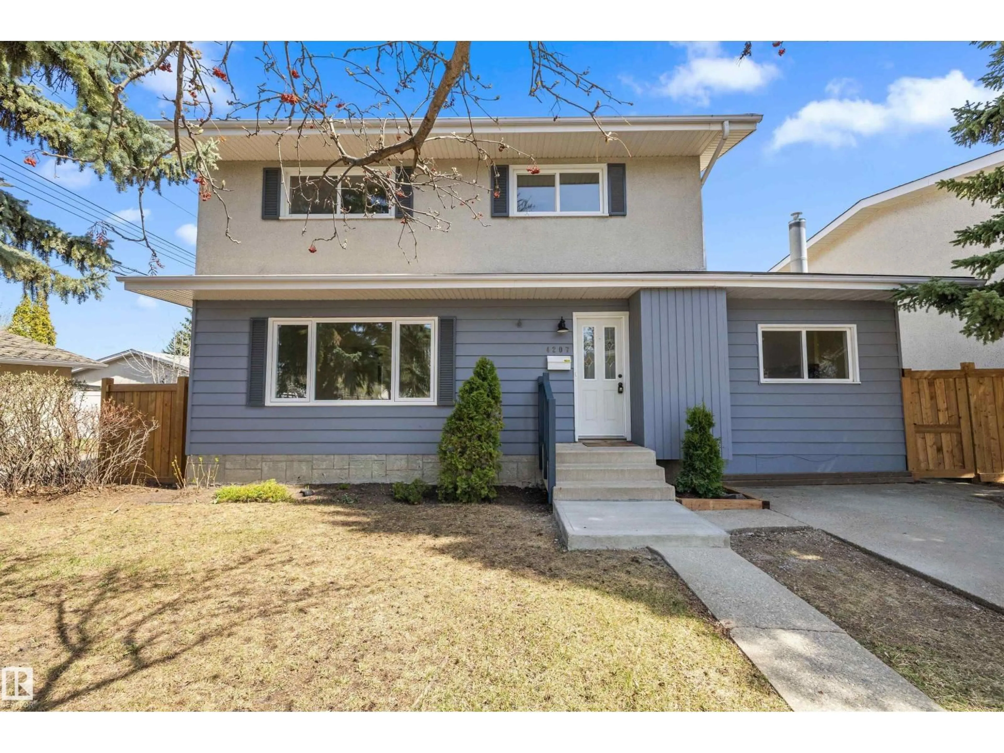 Home with vinyl exterior material, street for 4207 113 ST, Edmonton Alberta T6J1L2