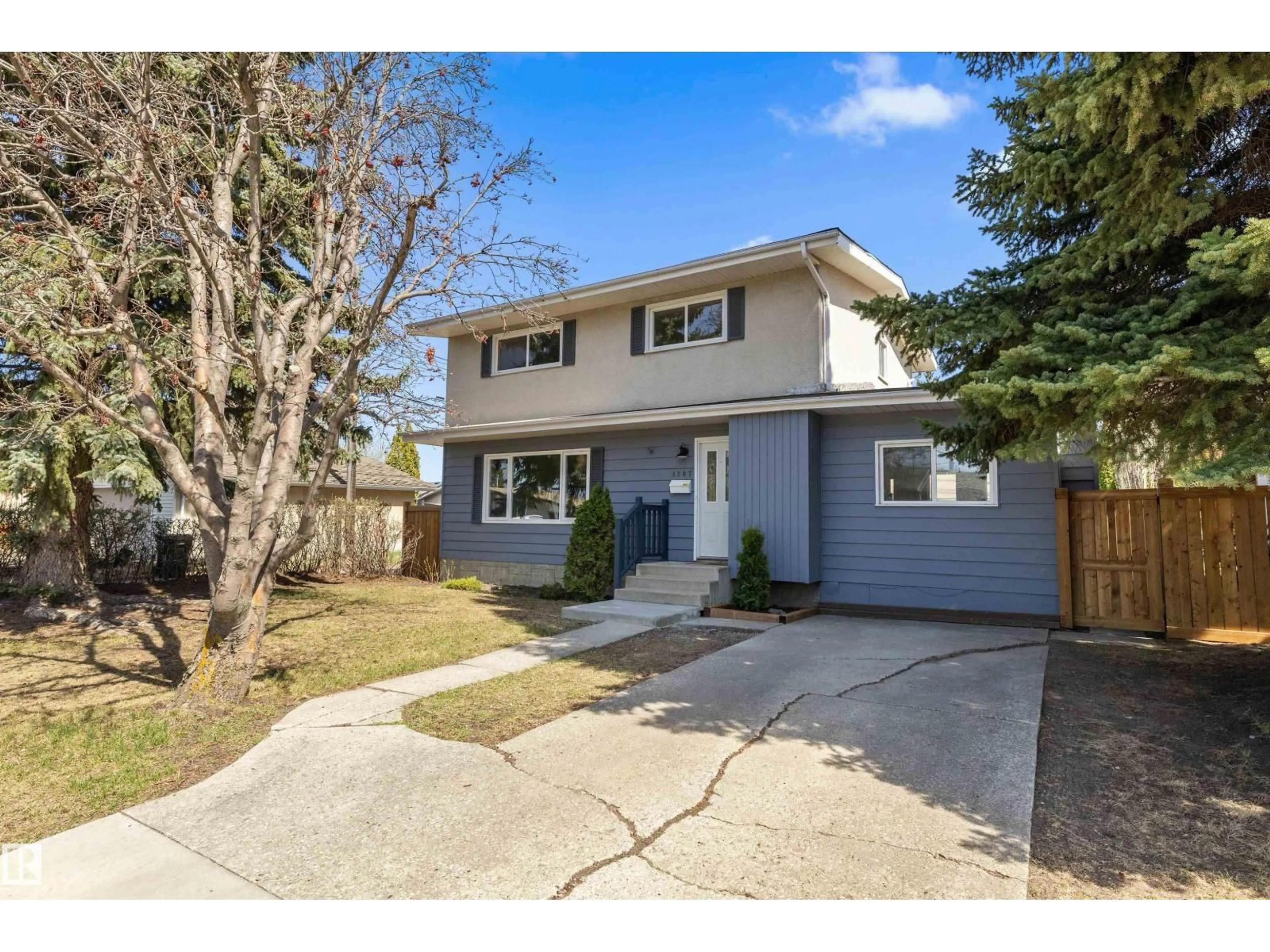 Home with vinyl exterior material, street for 4207 113 ST, Edmonton Alberta T6J1L2