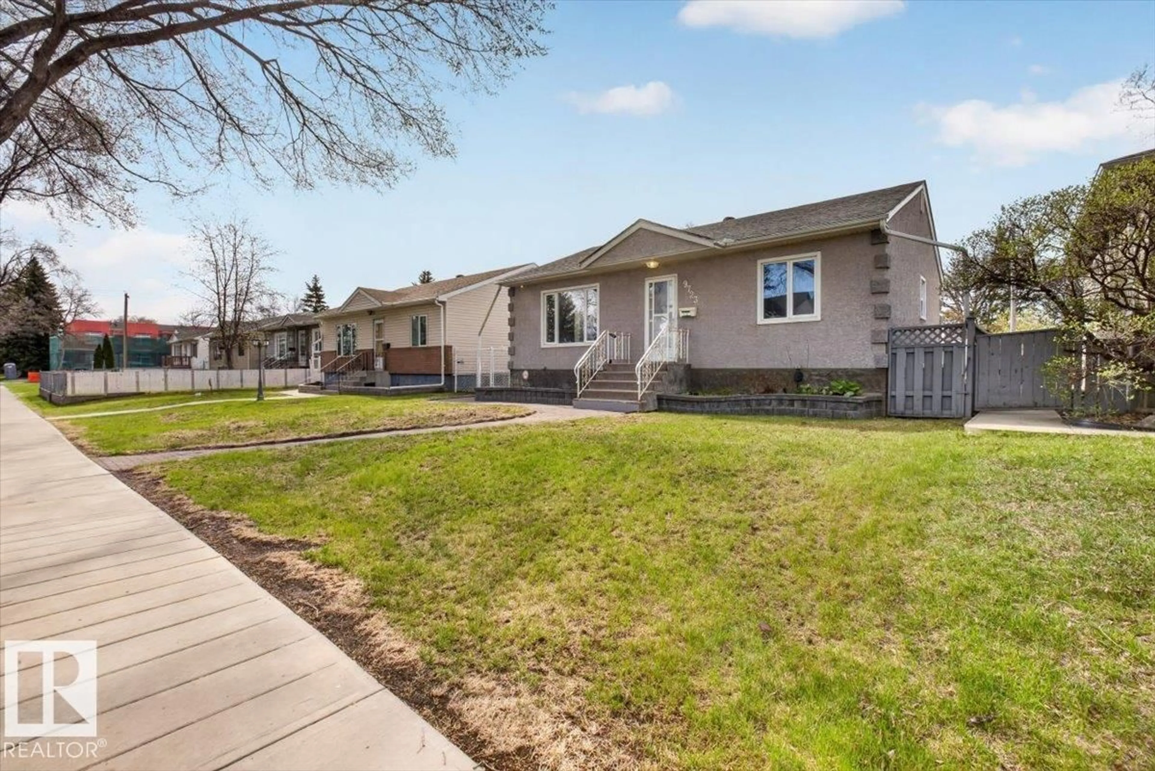 Home with vinyl exterior material, street for 9723 65 AV, Edmonton Alberta T6E0M4