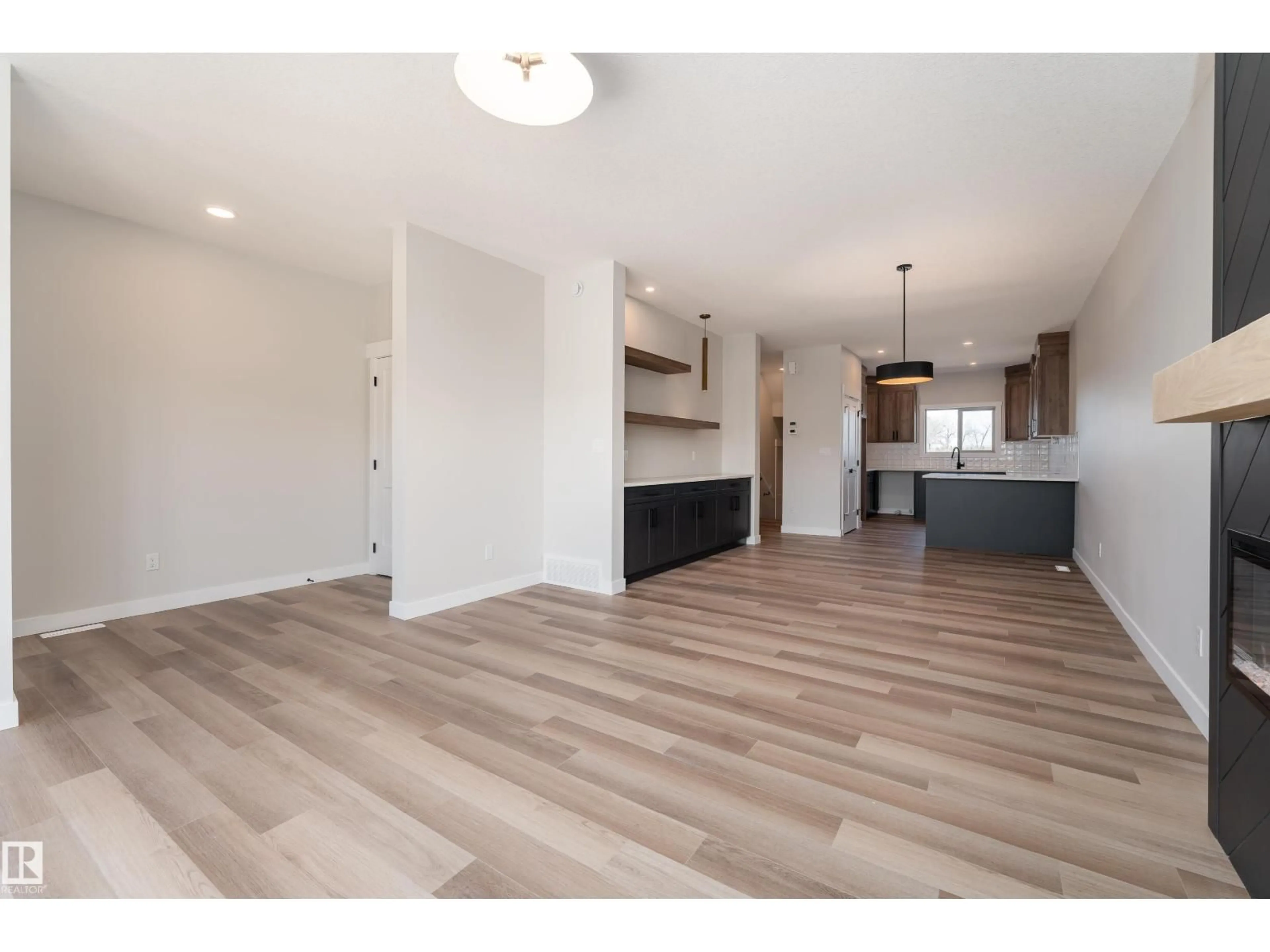 Open concept kitchen, wood/laminate floor for 138 GARNEAU GA, Spruce Grove Alberta T7X0Z6