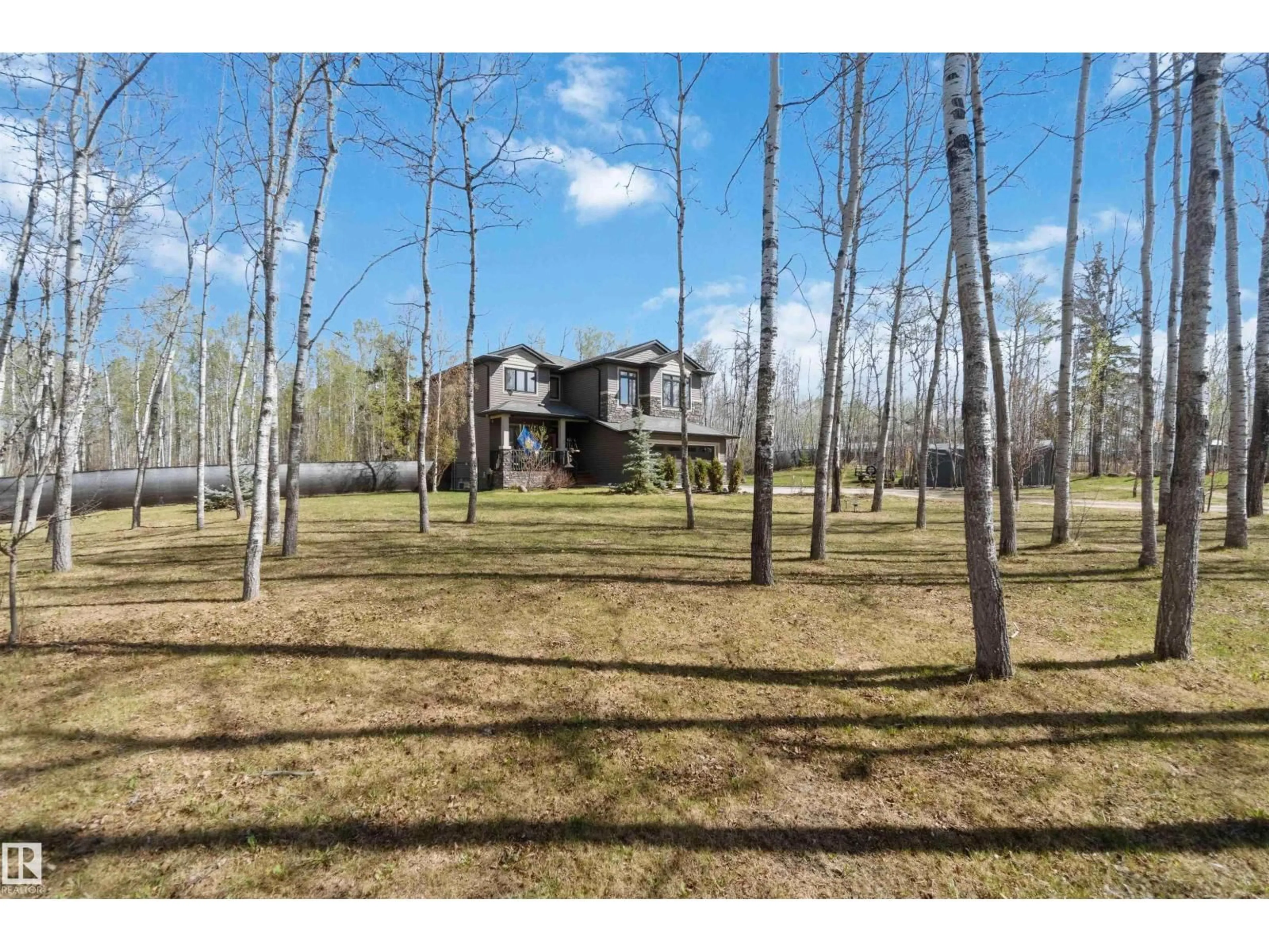 A pic from outside/outdoor area/front of a property/back of a property/a pic from drone, forest/trees view for #4 - 54406 RGE ROAD 15, Rural Lac Ste. Anne County Alberta T0E1V2