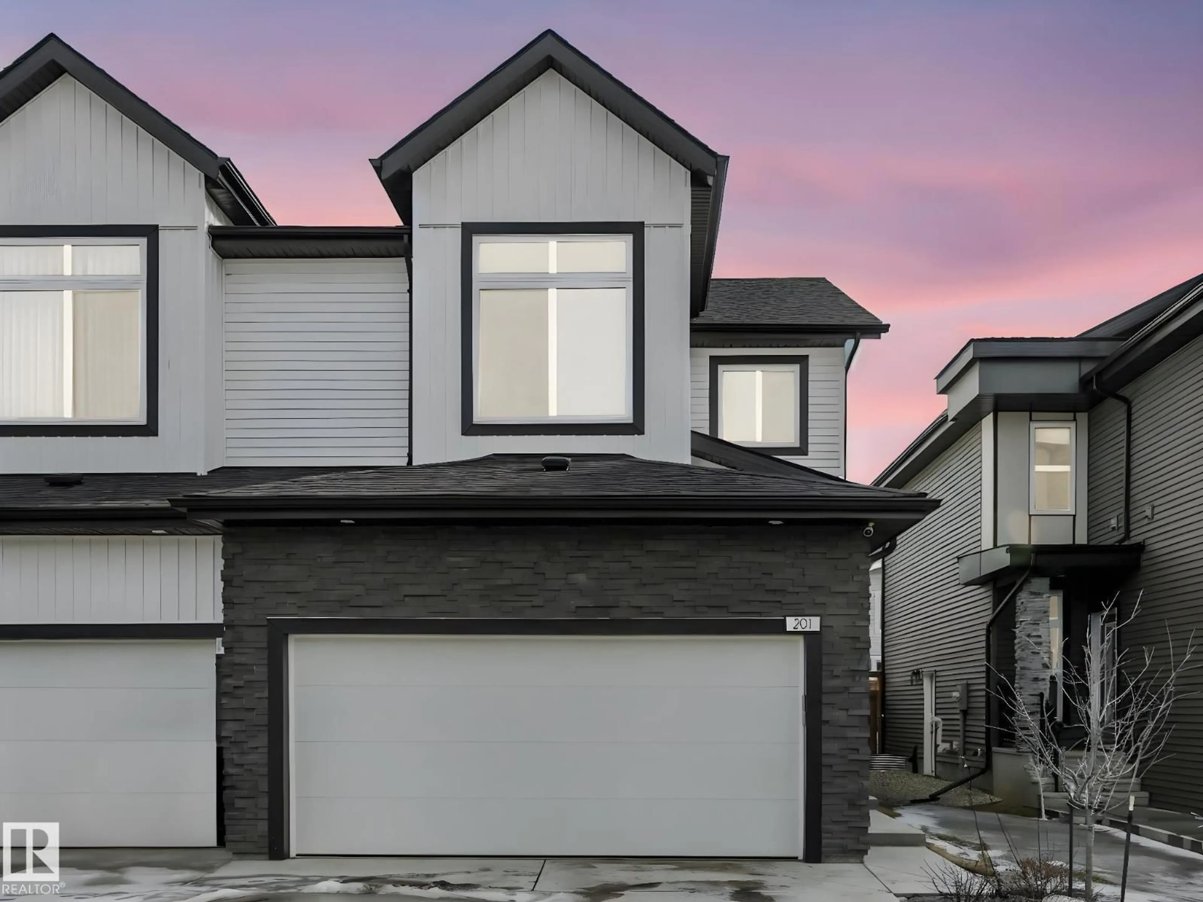 Home with vinyl exterior material, street for 201 STARLING WY, Fort Saskatchewan Alberta T8L1X5