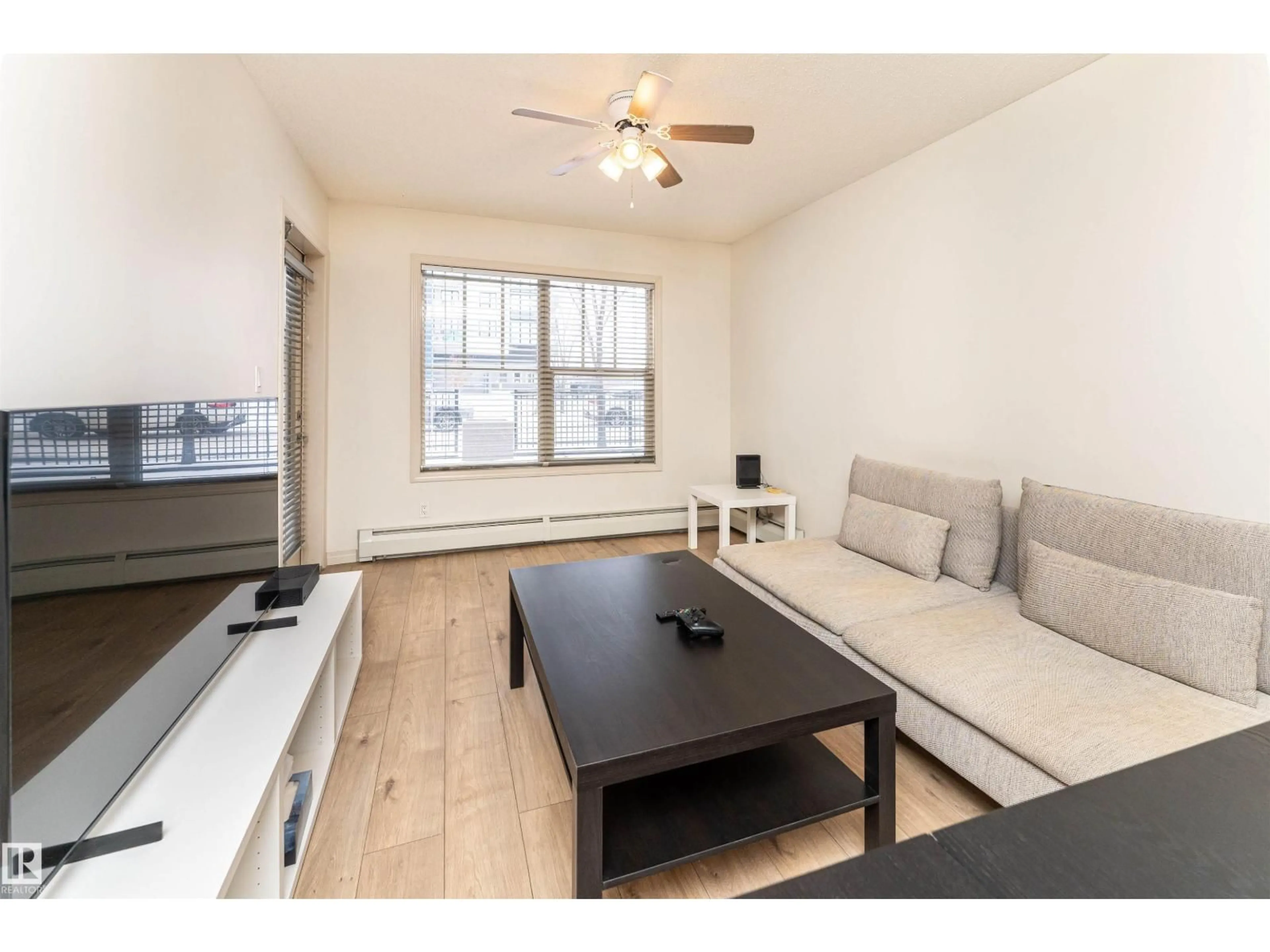 Living room with furniture, wood/laminate floor for #108 - 103 AMBLESIDE DR, Edmonton Alberta T6W0J4