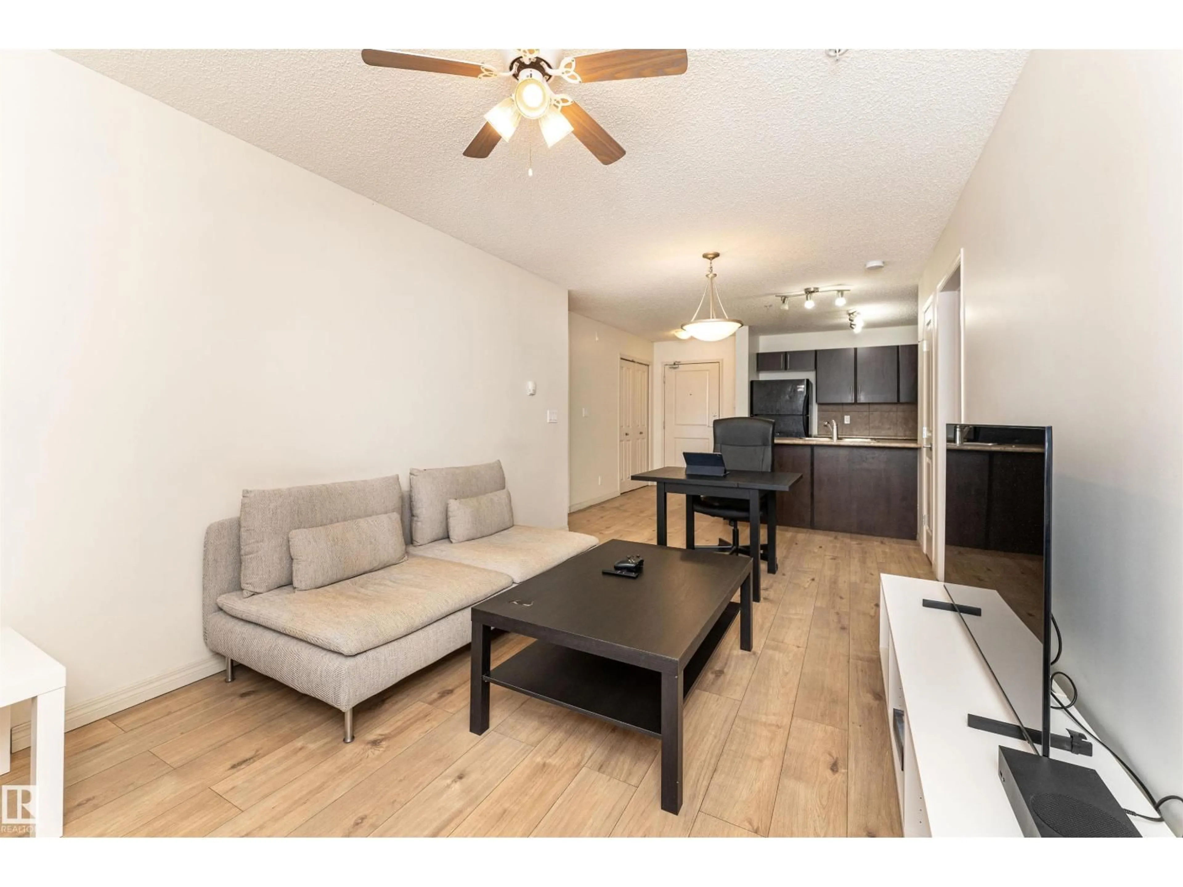 Living room with furniture, wood/laminate floor for #108 - 103 AMBLESIDE DR, Edmonton Alberta T6W0J4