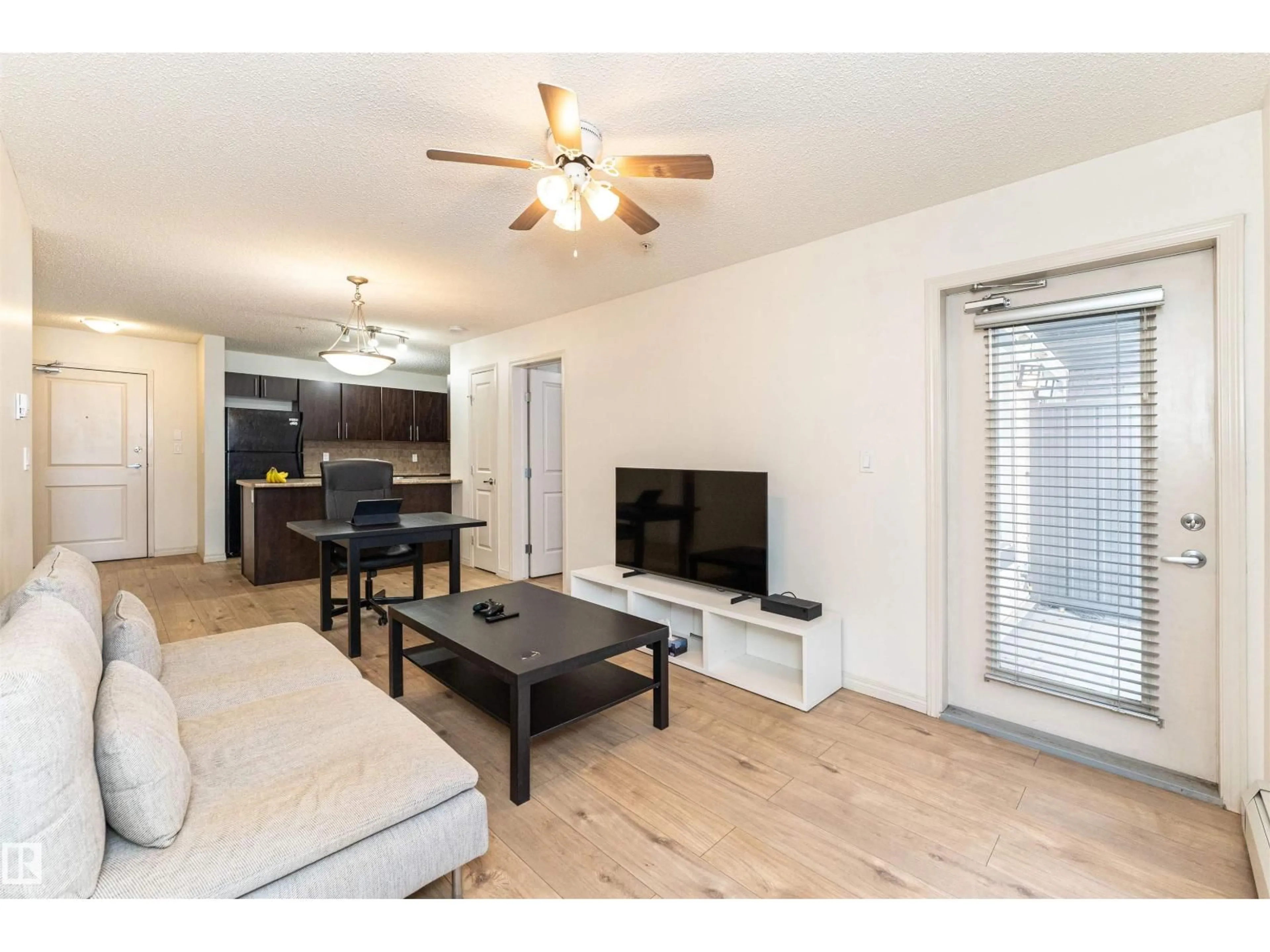 Living room with furniture, wood/laminate floor for #108 - 103 AMBLESIDE DR, Edmonton Alberta T6W0J4