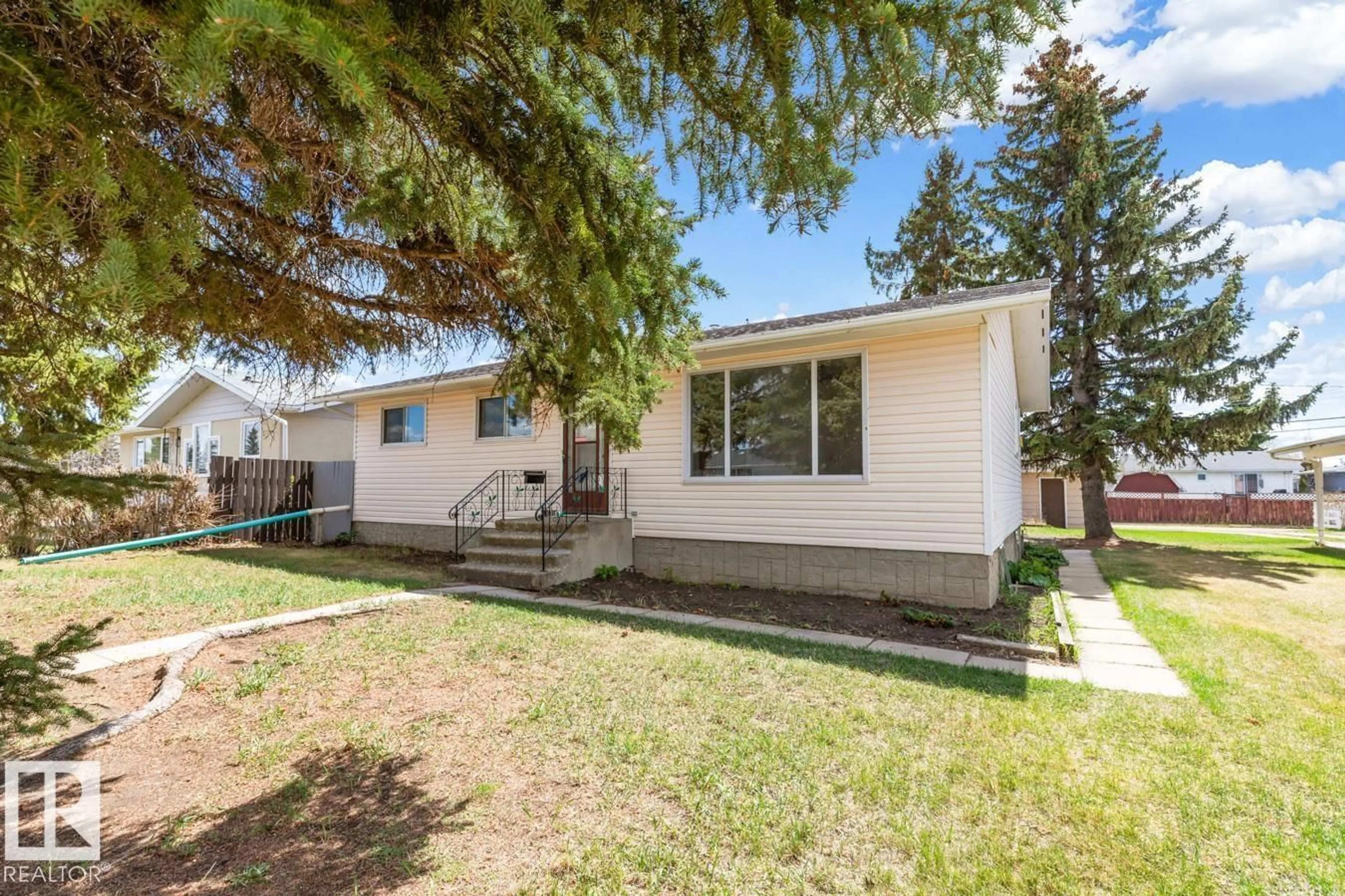 Home with vinyl exterior material, street for 10103 104 AV, Morinville Alberta T8R1A8