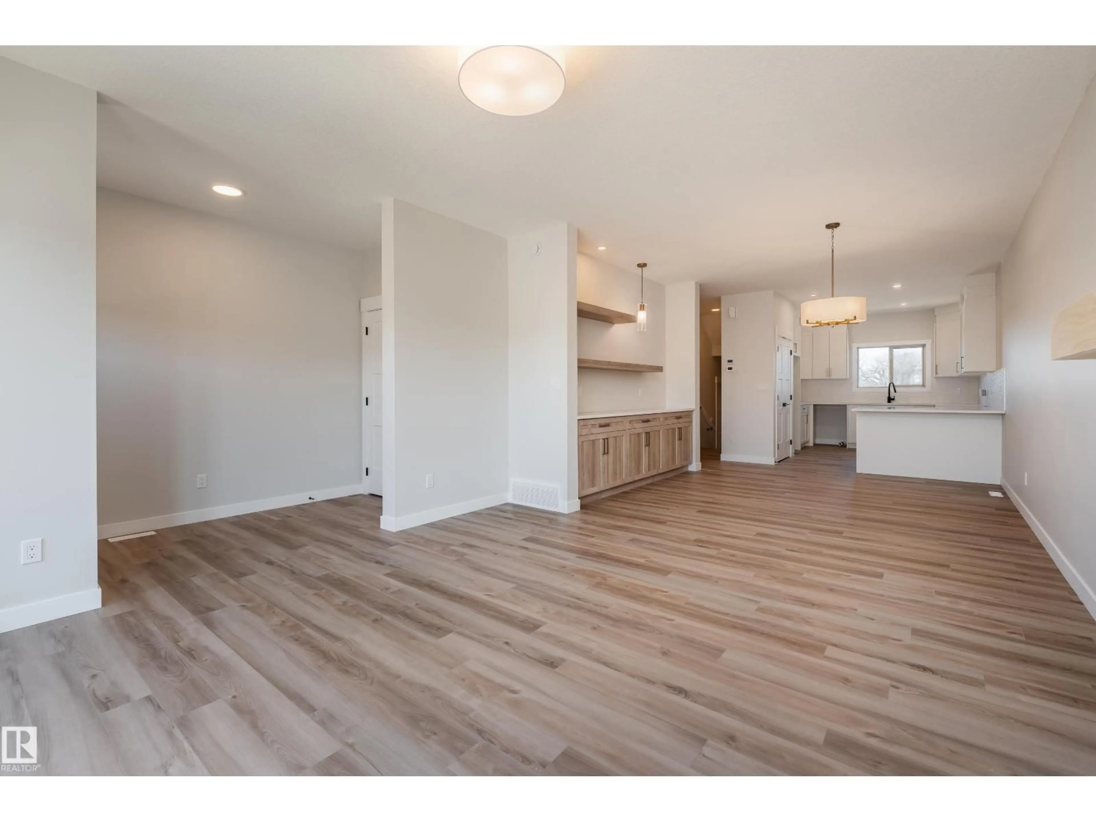 Open concept kitchen, wood/laminate floor for 140 GARNEAU GA, Spruce Grove Alberta T7X0Z6