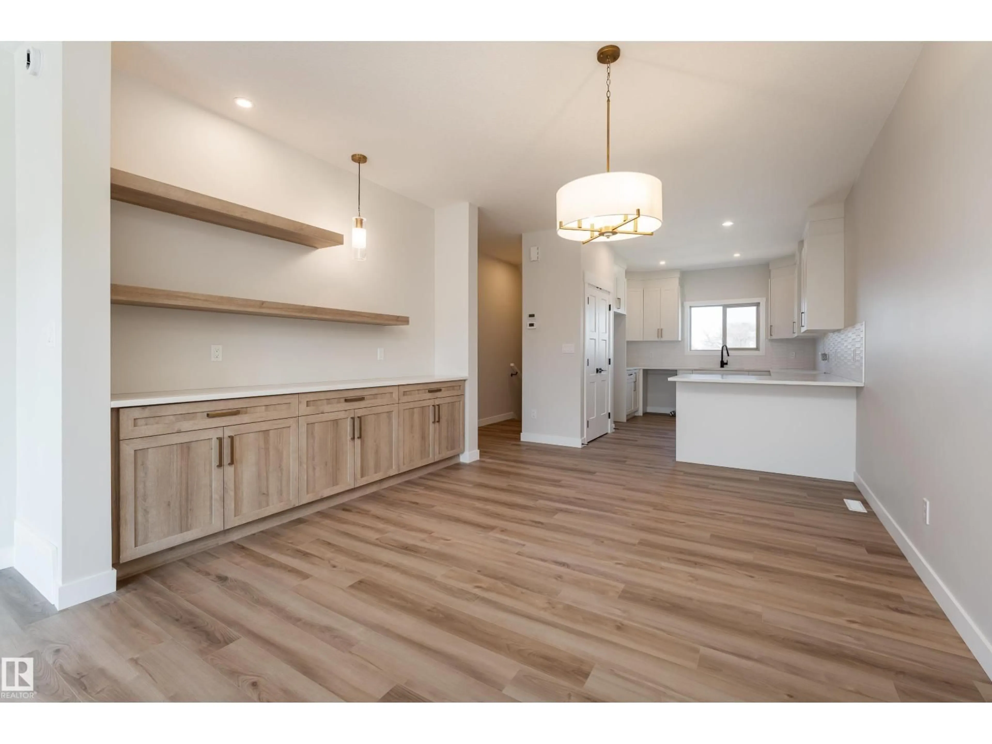 Open concept kitchen, wood/laminate floor for 140 GARNEAU GA, Spruce Grove Alberta T7X0Z6