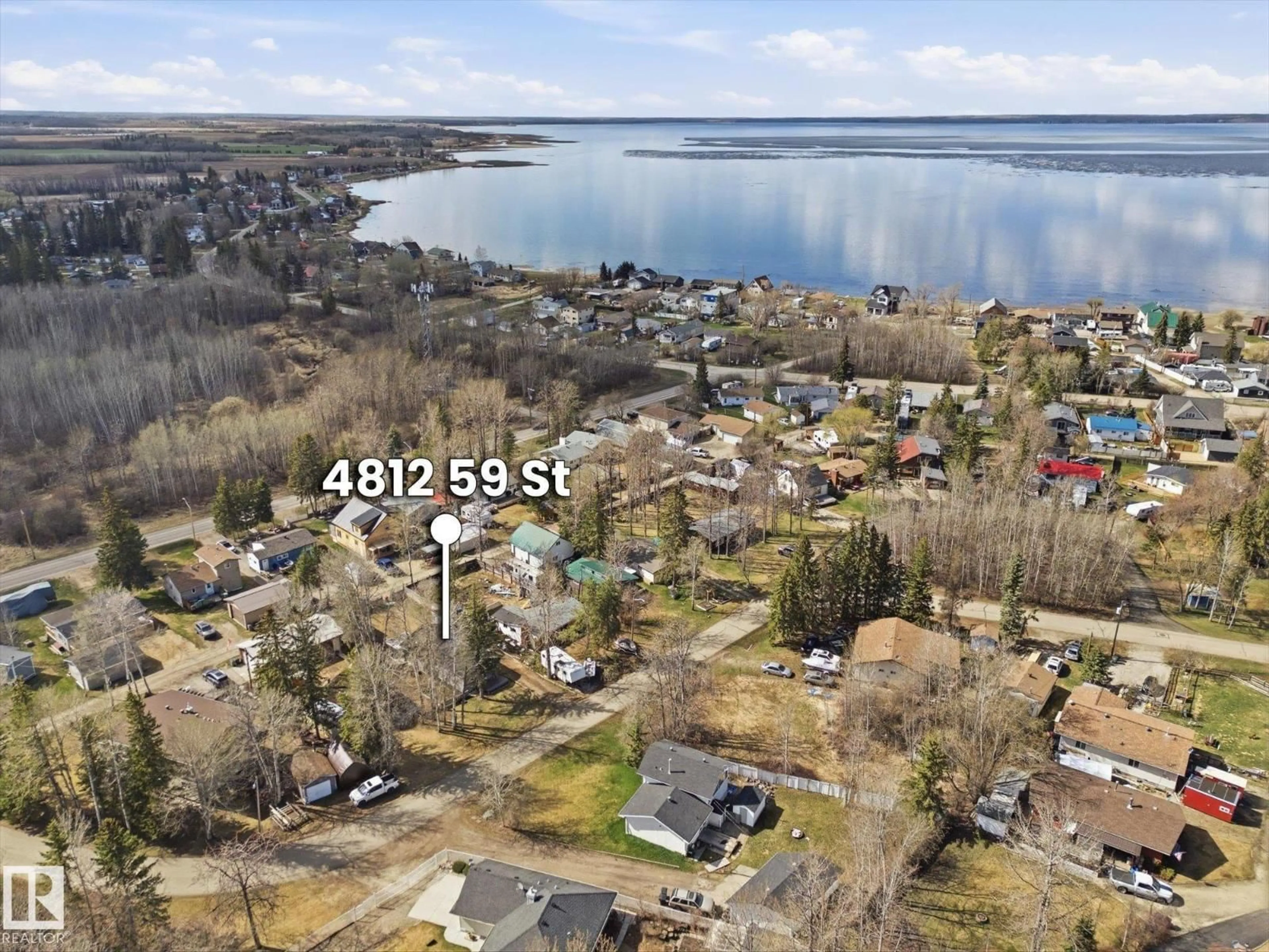 A pic from outside/outdoor area/front of a property/back of a property/a pic from drone, water/lake/river/ocean view for 4812 59 ST, Rural Lac Ste. Anne County Alberta T0E0A0